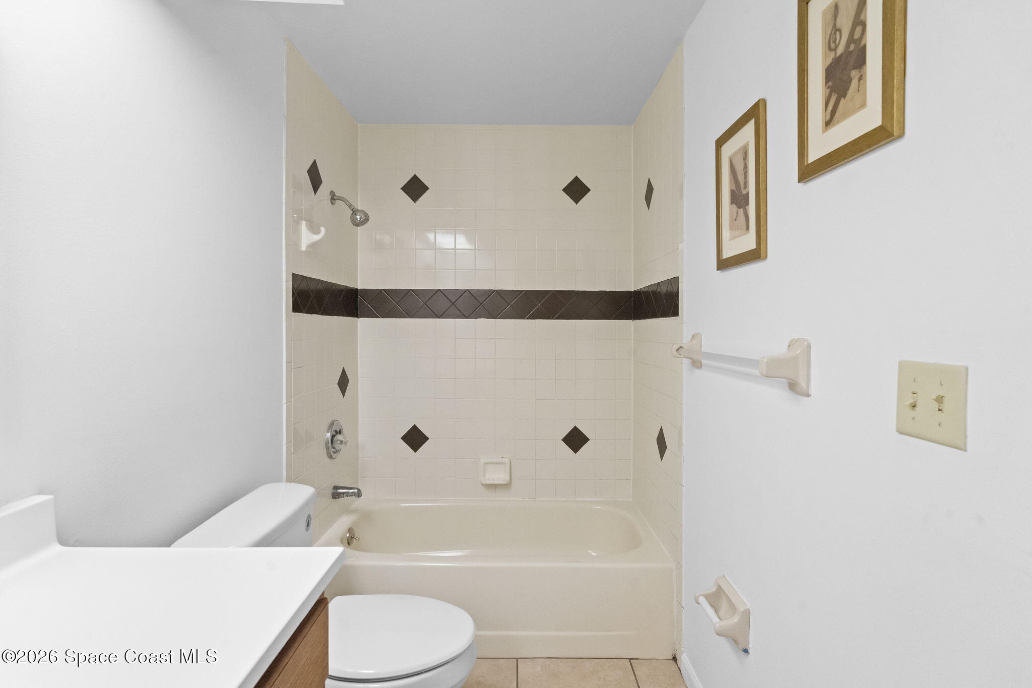 4550 Piedras Street Cocoa, FL 32927 - Photo 31 of 53 a bathroom with a sink toilet and shower