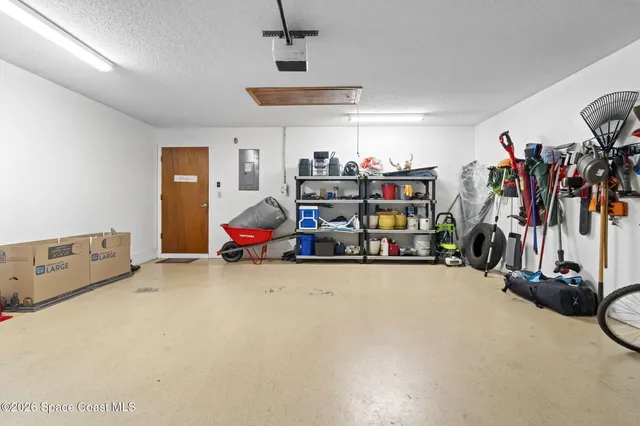 a view of a garage with a flat screen tv