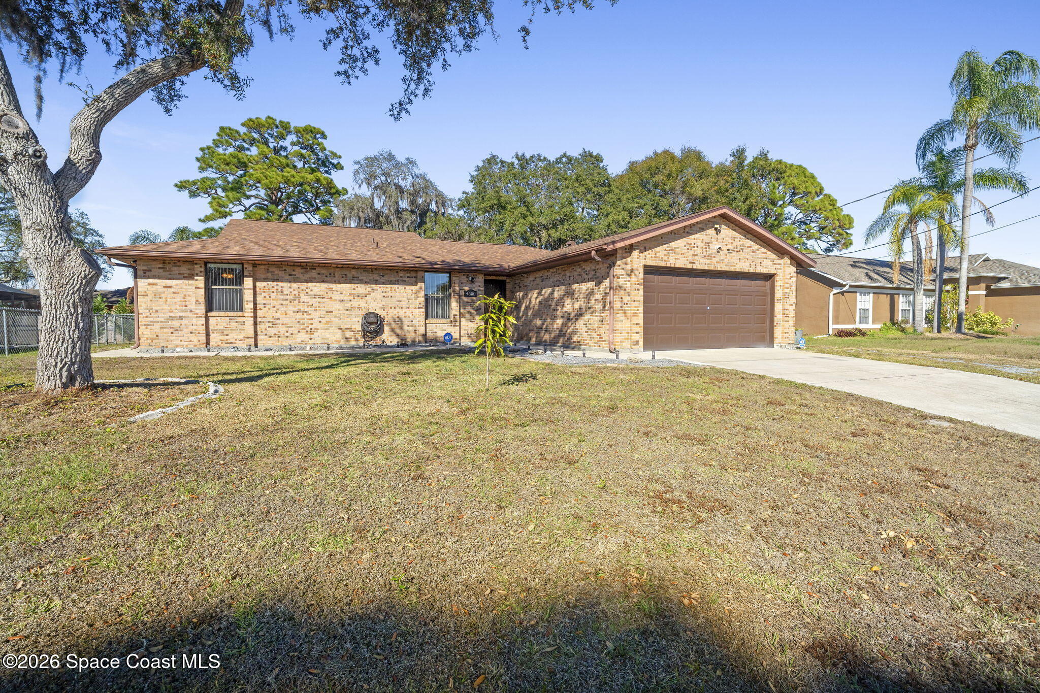 4550 Piedras Street Cocoa, FL 32927 - Photo 42 of 53 a front view of a house with a yard