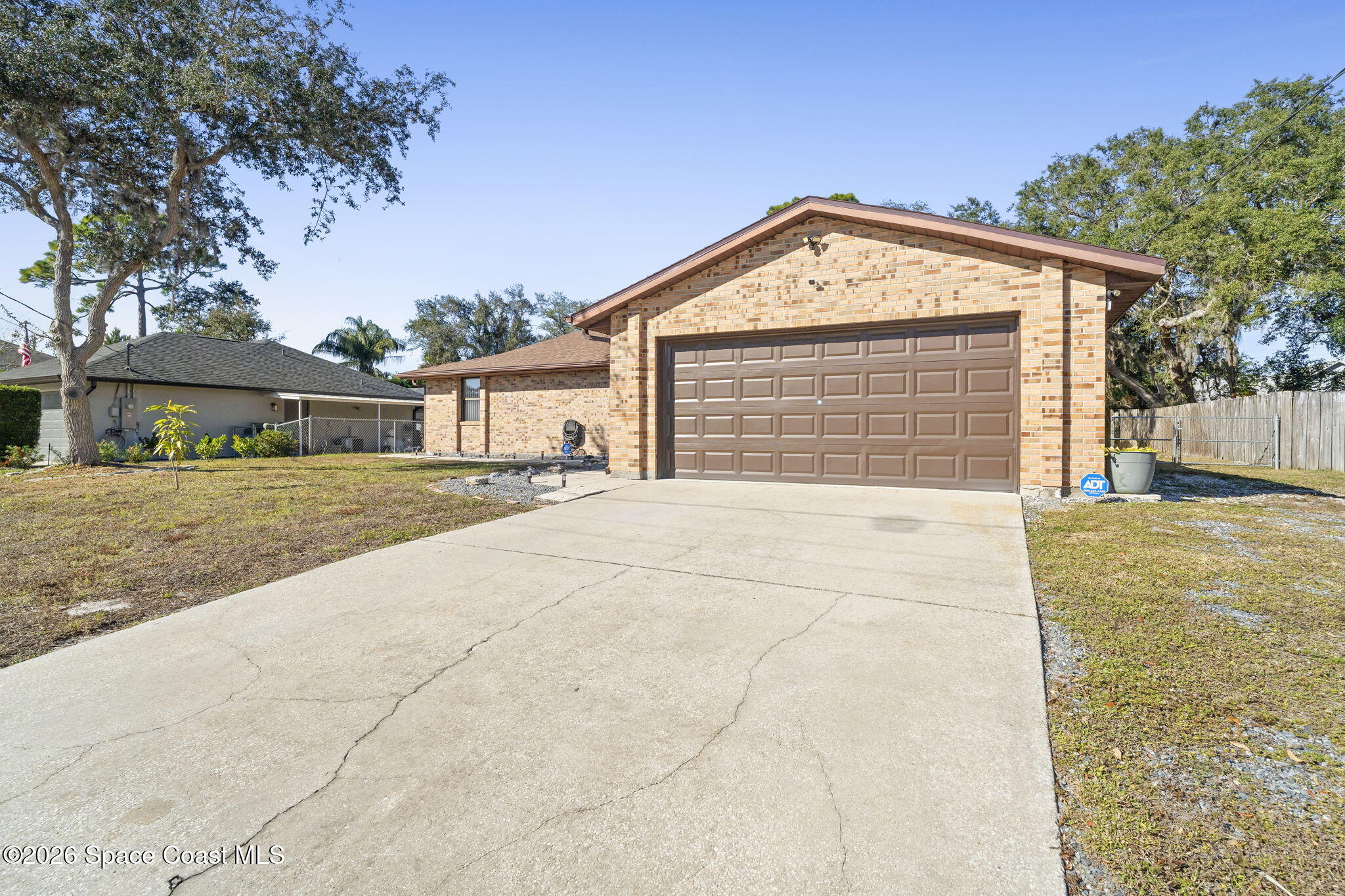 4550 Piedras Street Cocoa, FL 32927 - Photo 43 of 53 a view of house with backyard and trees in the background