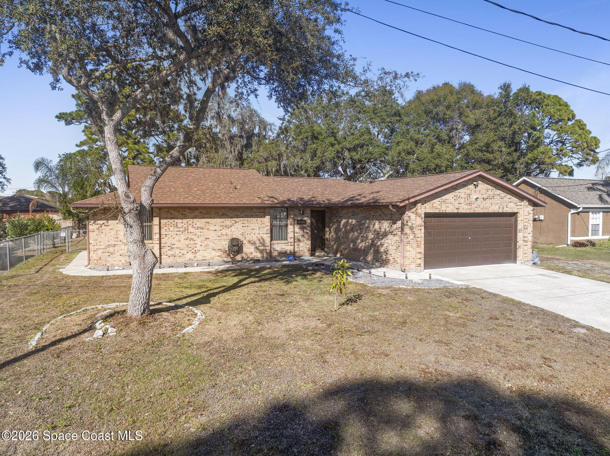 4550 Piedras Street Cocoa, FL 32927 - Photo 44 of 53 a view of a house with a yard