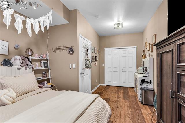 182 Raptor Court Canon City, CO 81212 - Photo 25 of 50 This bedroom at the end of the hallway includes an egress window and is conveniently located near the full bathroom, making it ideal for guests or everyday use.