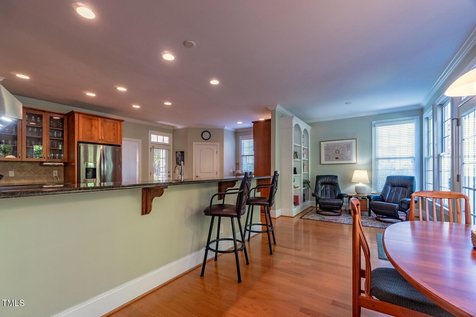 4211 Forest Edge Trail Durham, NC 27705 - Photo 11 of 62 a living room with fireplace furniture wooden floor and a window