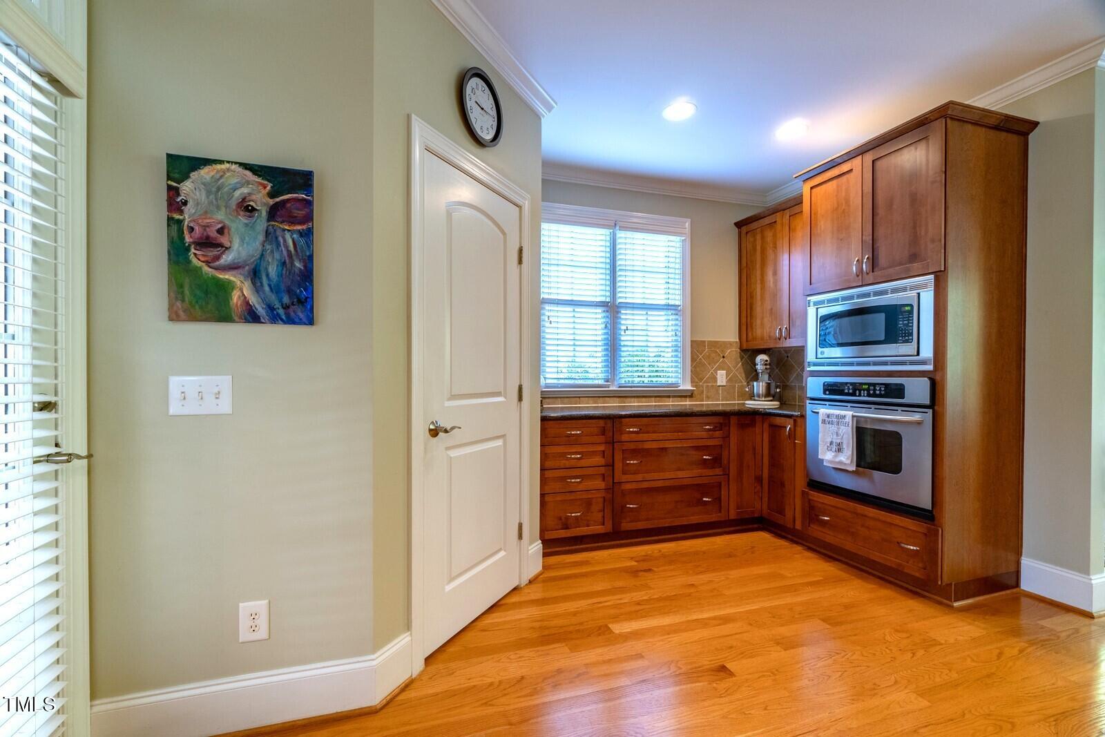 4211 Forest Edge Trail Durham, NC 27705 - Photo 20 of 62 a kitchen with stainless steel appliances a refrigerator and a stove top oven