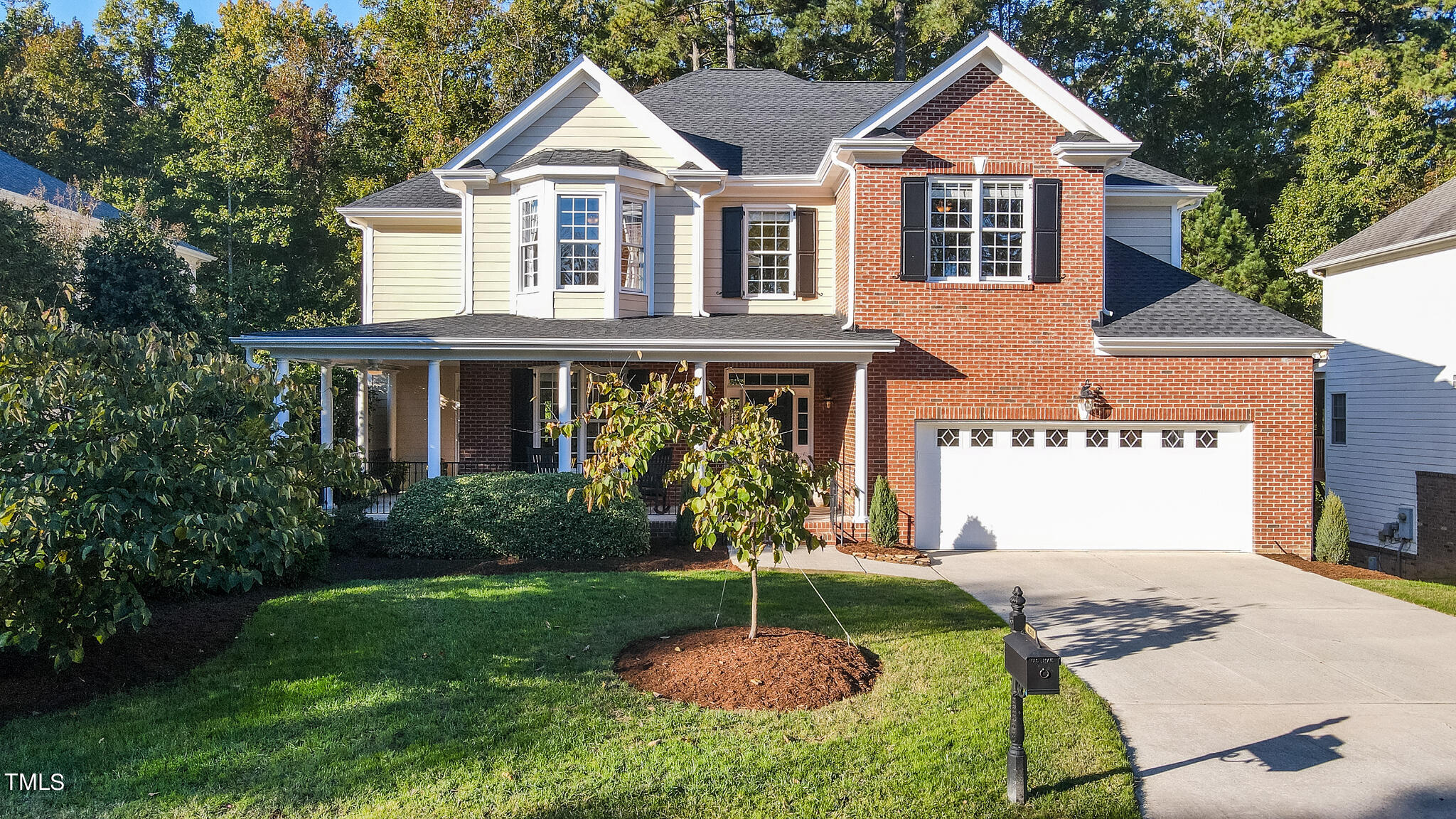 4211 Forest Edge Trail Durham, NC 27705 - Photo 2 of 62 a front view of a house with a yard and garage