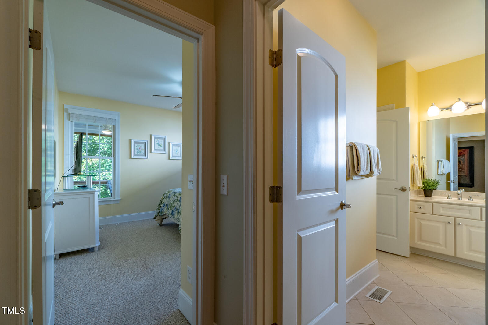 4211 Forest Edge Trail Durham, NC 27705 - Photo 27 of 62 a bathroom with a sink and mirror with toilet