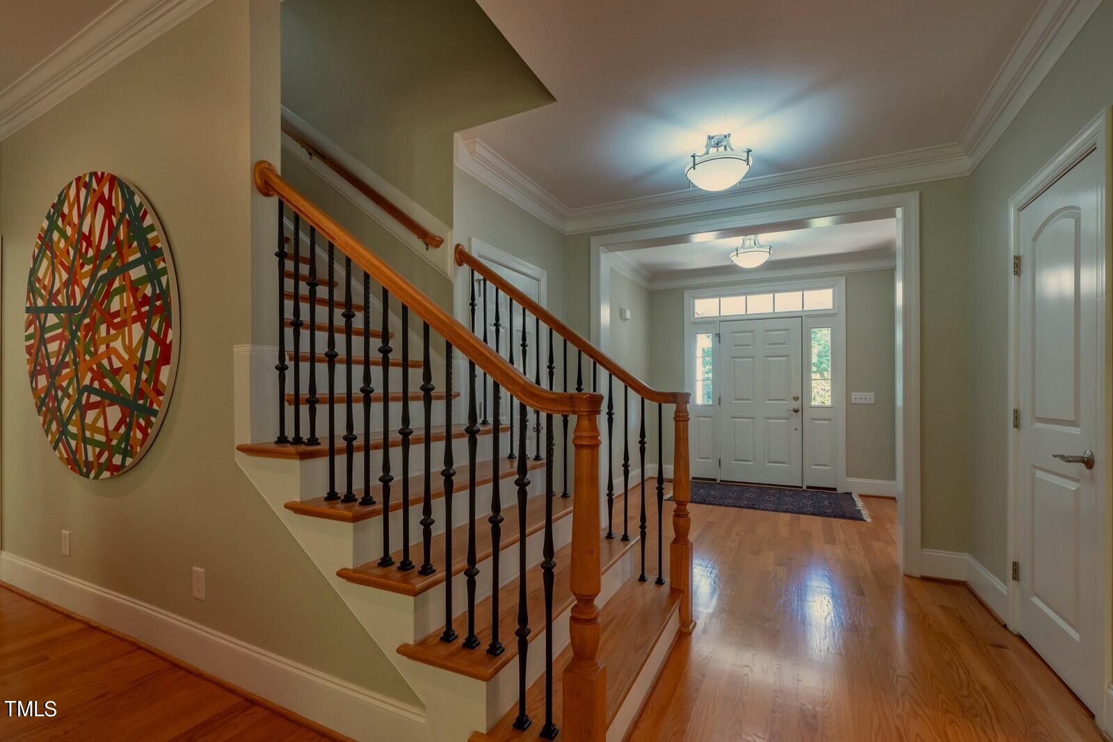 4211 Forest Edge Trail Durham, NC 27705 - Photo 29 of 62 a view of staircase with railing and a chandelier