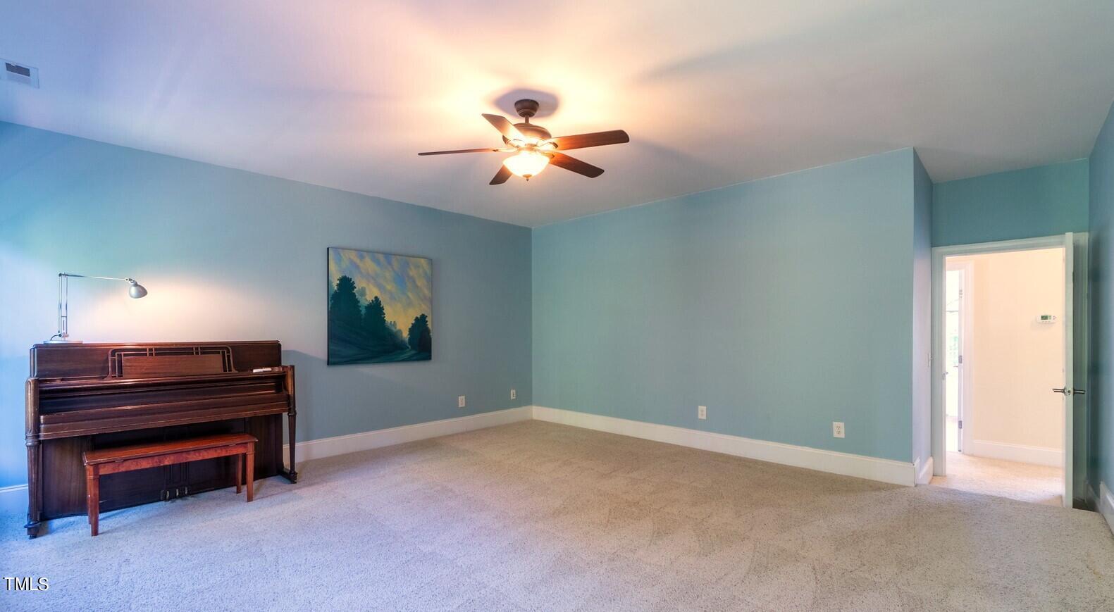 4211 Forest Edge Trail Durham, NC 27705 - Photo 42 of 62 a view of room with a piano and wooden floor