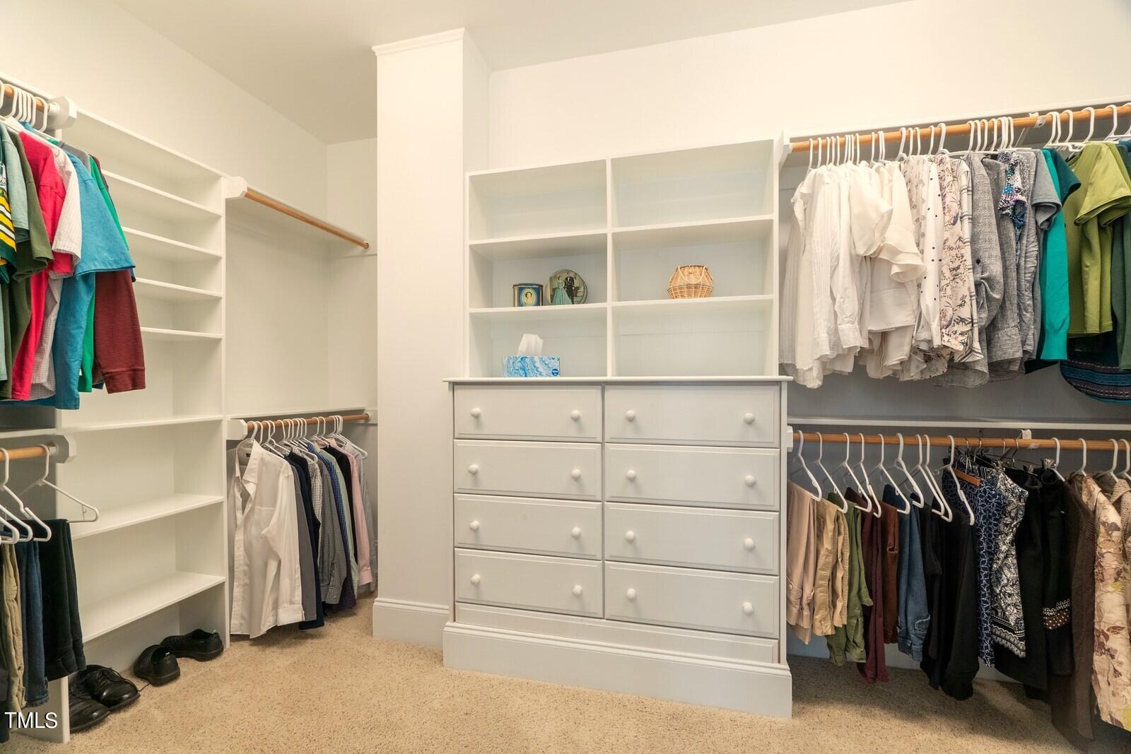 4211 Forest Edge Trail Durham, NC 27705 - Photo 47 of 62 a view of walk in closet with clothes and shoes