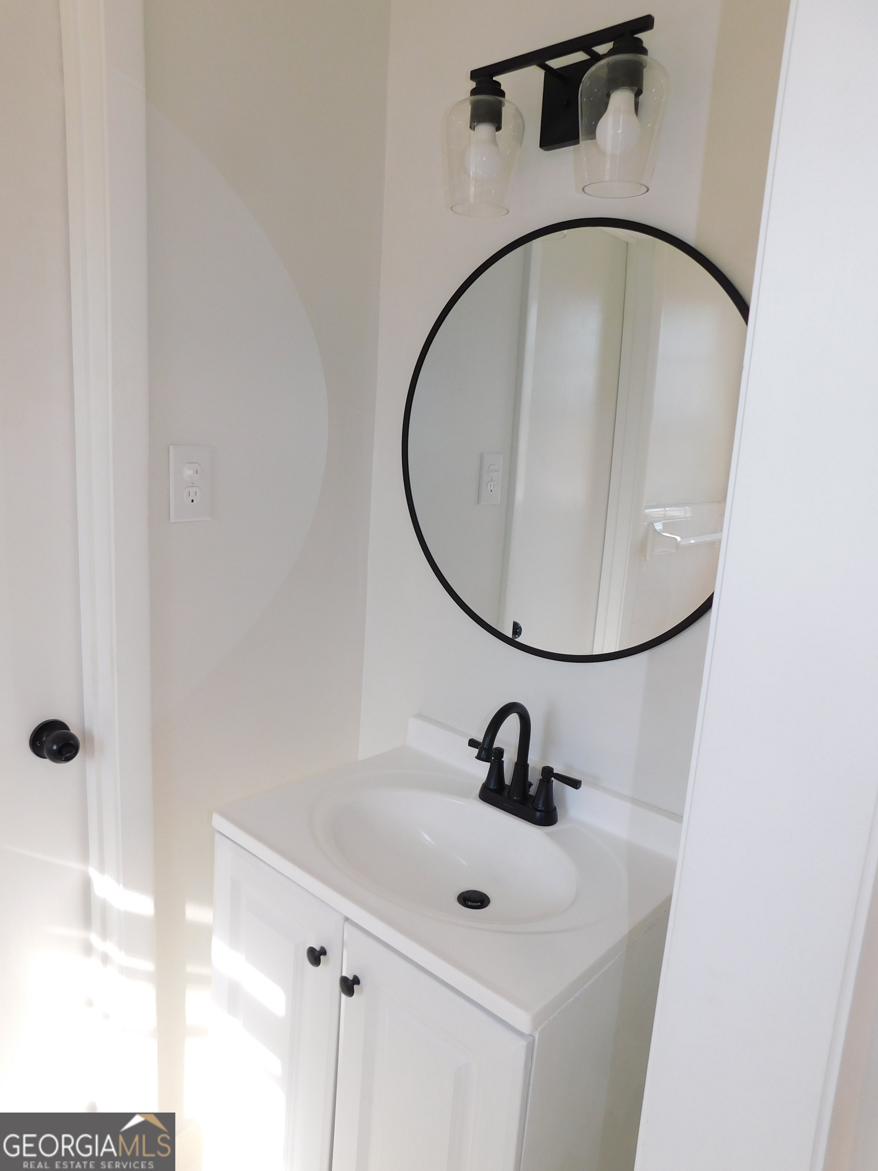 4371 Aldergate Drive Decatur, GA 30035 - Photo 21 of 37 a bathroom with a sink and mirror