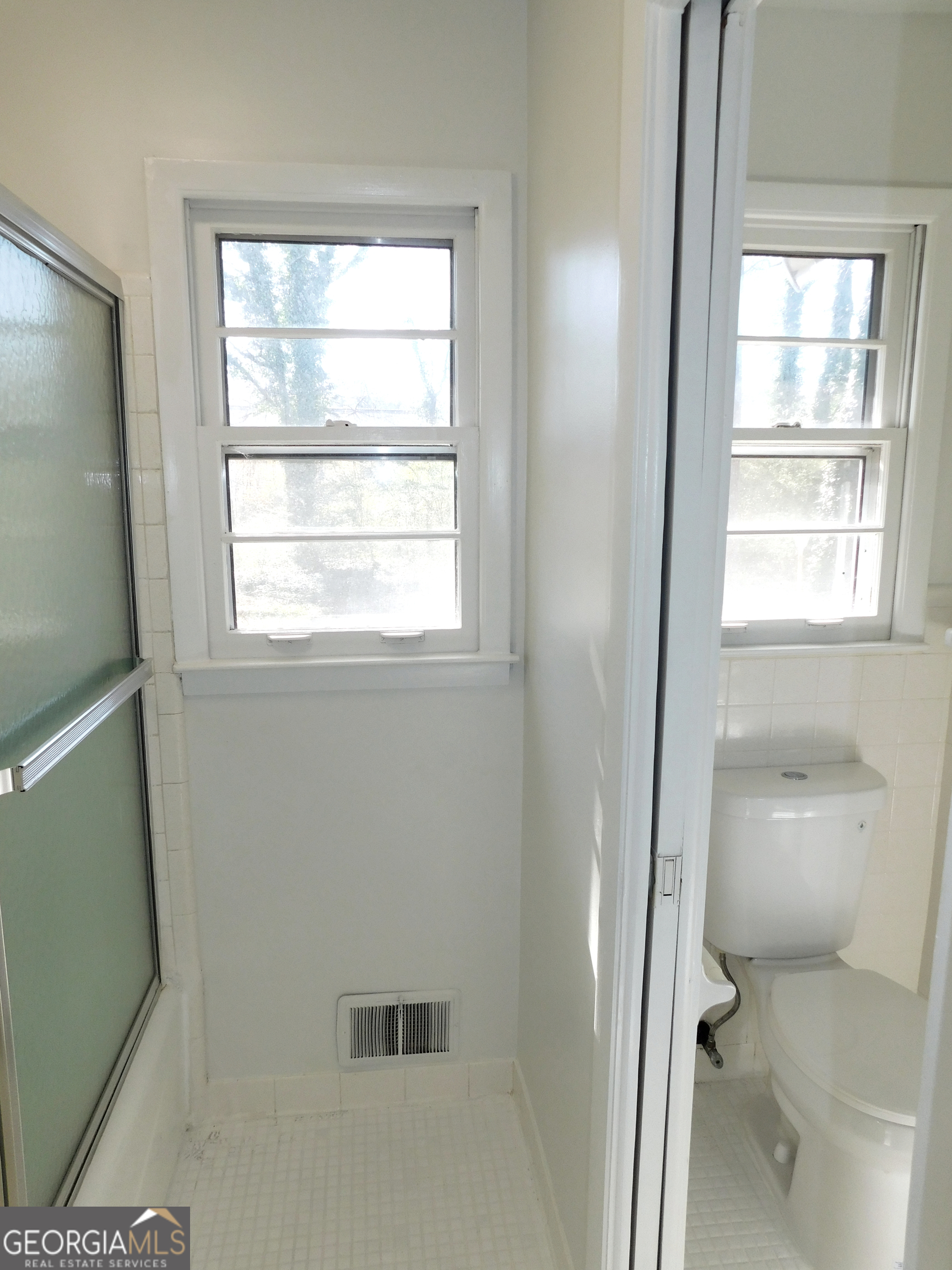 4371 Aldergate Drive Decatur, GA 30035 - Photo 23 of 37 a bathroom with a glass shower door
