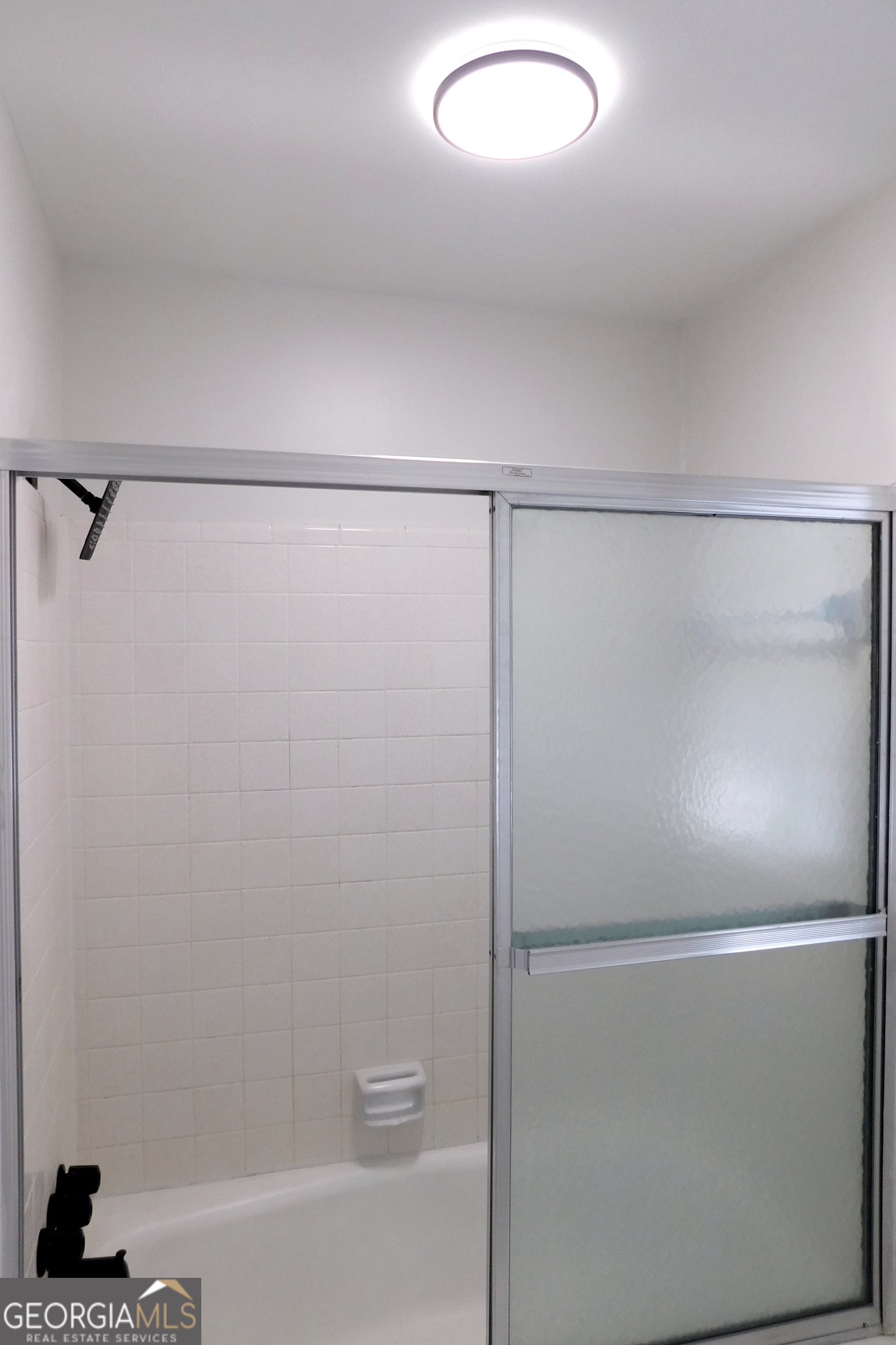 4371 Aldergate Drive Decatur, GA 30035 - Photo 25 of 37 a bathroom with a glass shower door