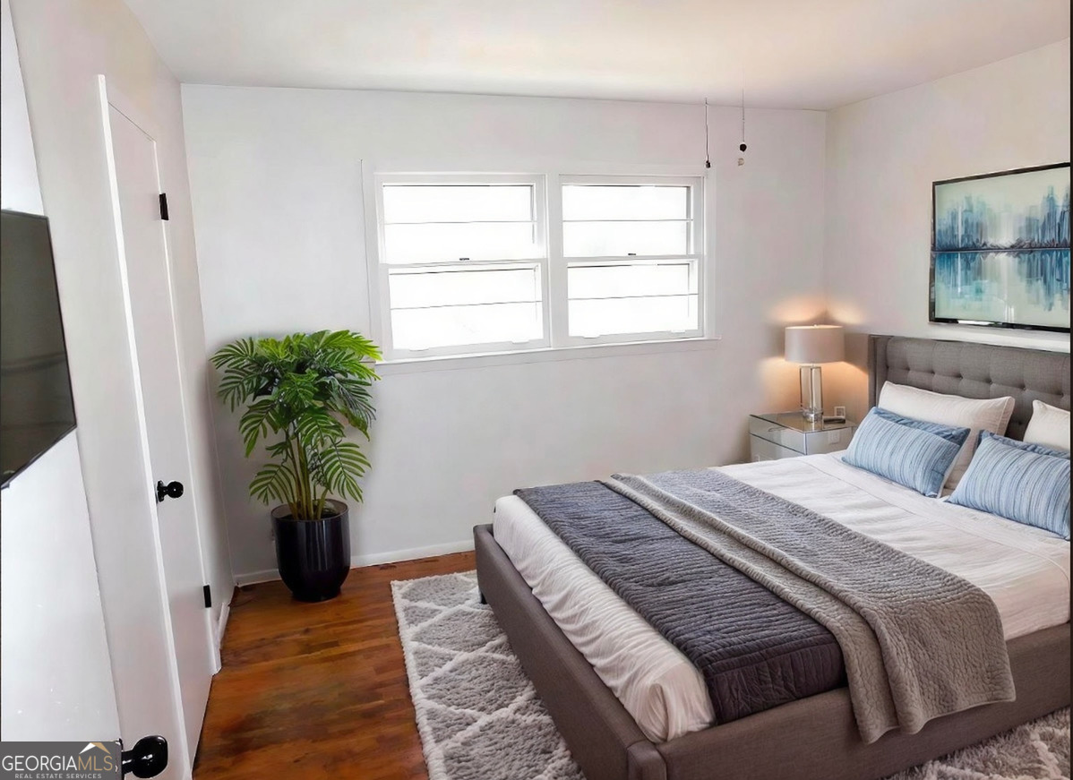 4371 Aldergate Drive Decatur, GA 30035 - Photo 8 of 37 a bed room with a bed and a potted plant