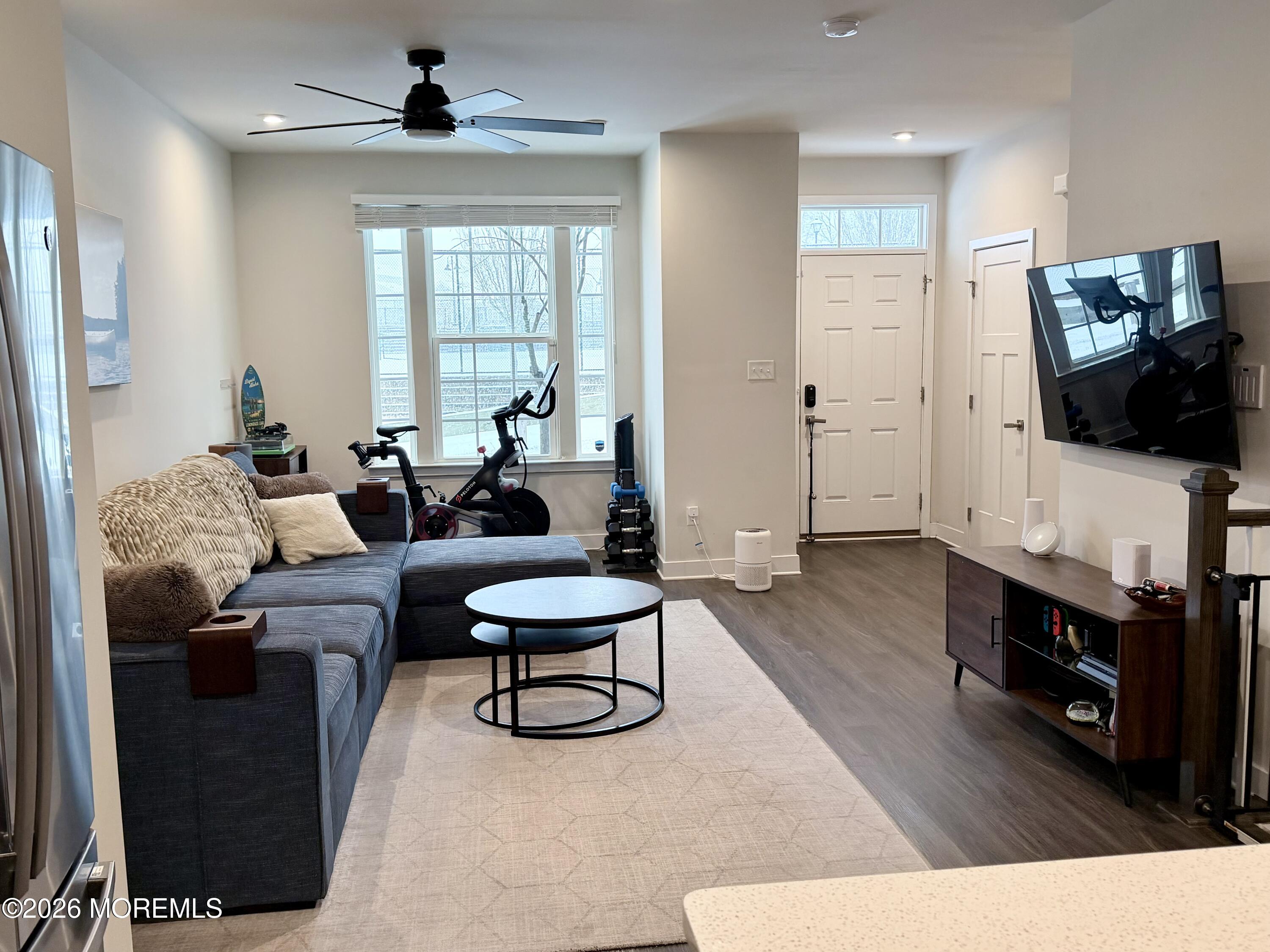 1207 English Lane, Unit 1207 Parlin, NJ 08859 - Photo 11 of 56 a living room with furniture and a flat screen tv