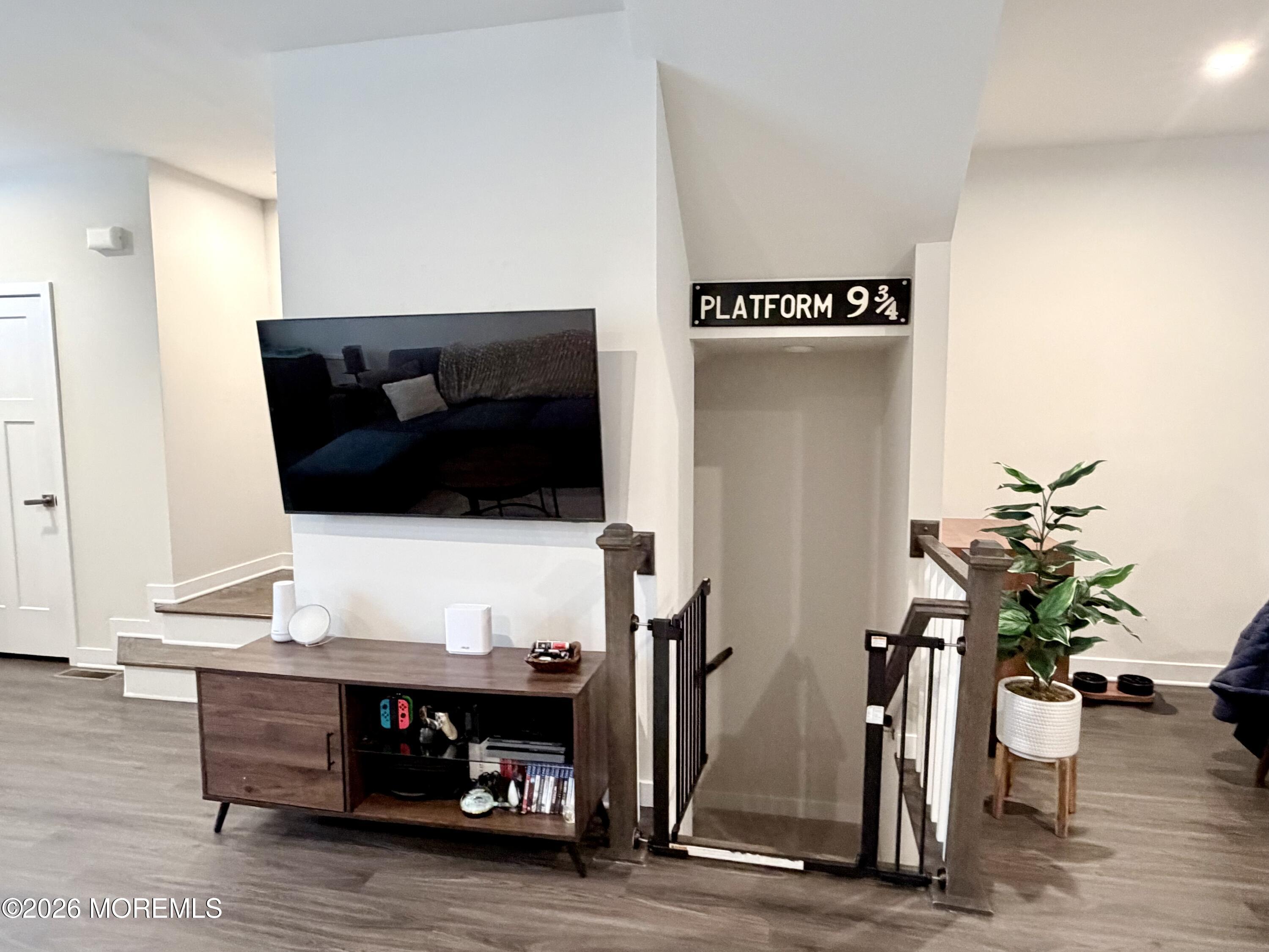 1207 English Lane, Unit 1207 Parlin, NJ 08859 - Photo 12 of 56 a living room with furniture and a flat screen tv