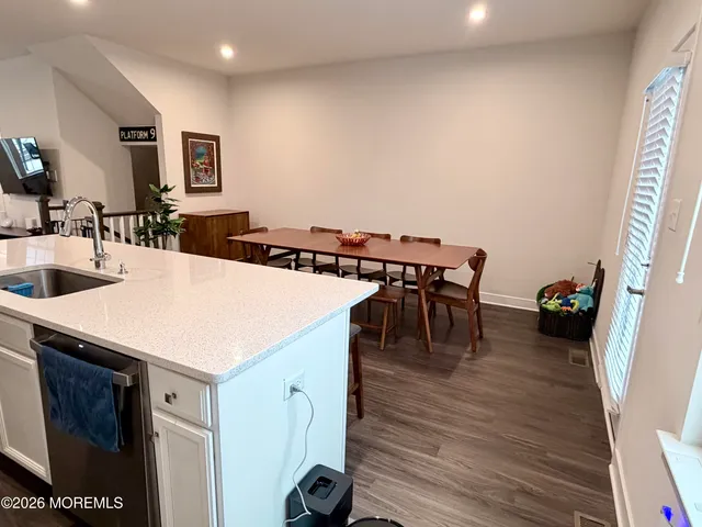 a view of hallway with stairs and a closet