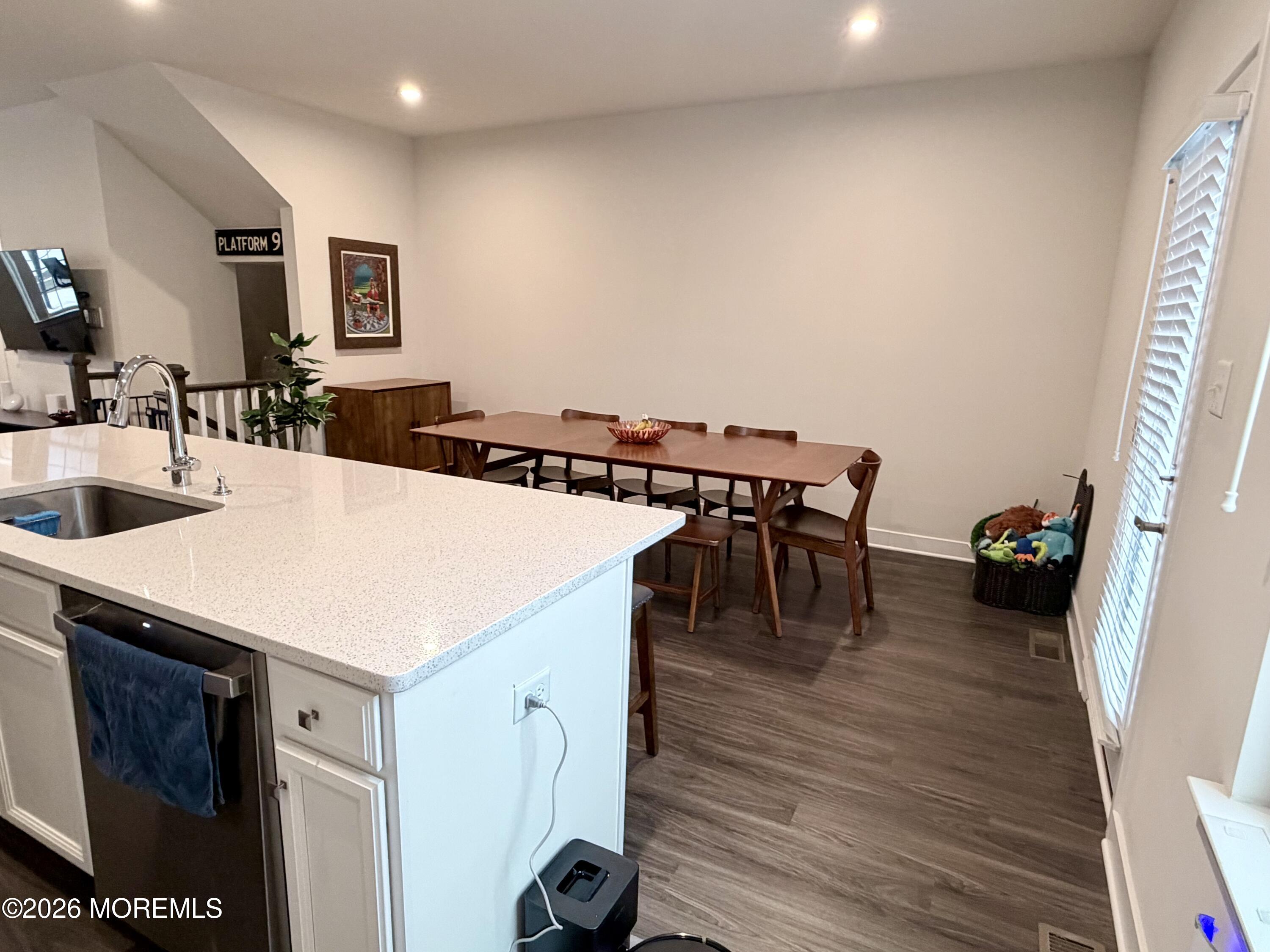 1207 English Lane, Unit 1207 Parlin, NJ 08859 - Photo 17 of 56 a view of a dining room with furniture and wooden floor