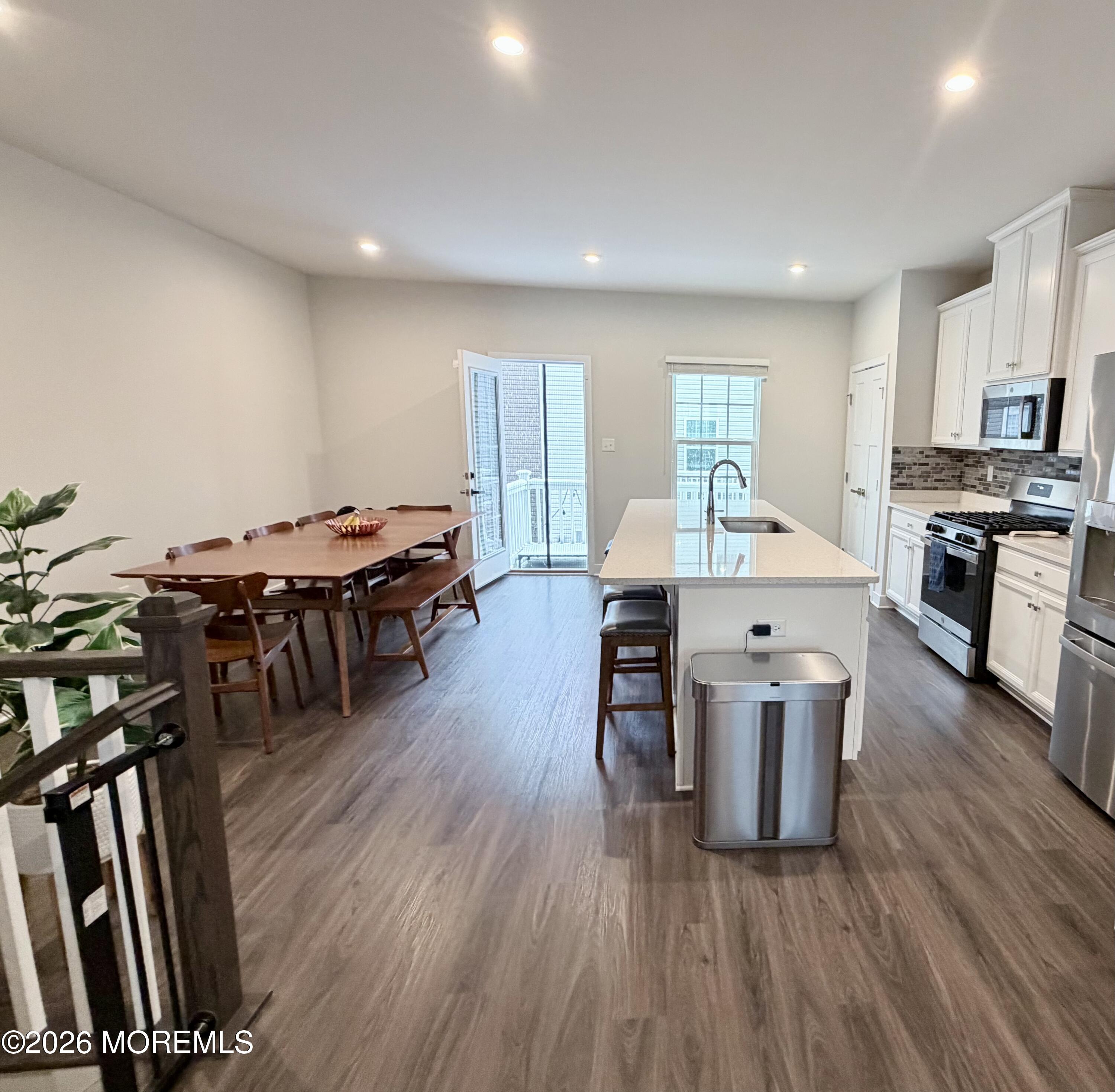 1207 English Lane, Unit 1207 Parlin, NJ 08859 - Photo 18 of 56 a large kitchen with lots of counter space a sink a window and stainless steel appliances