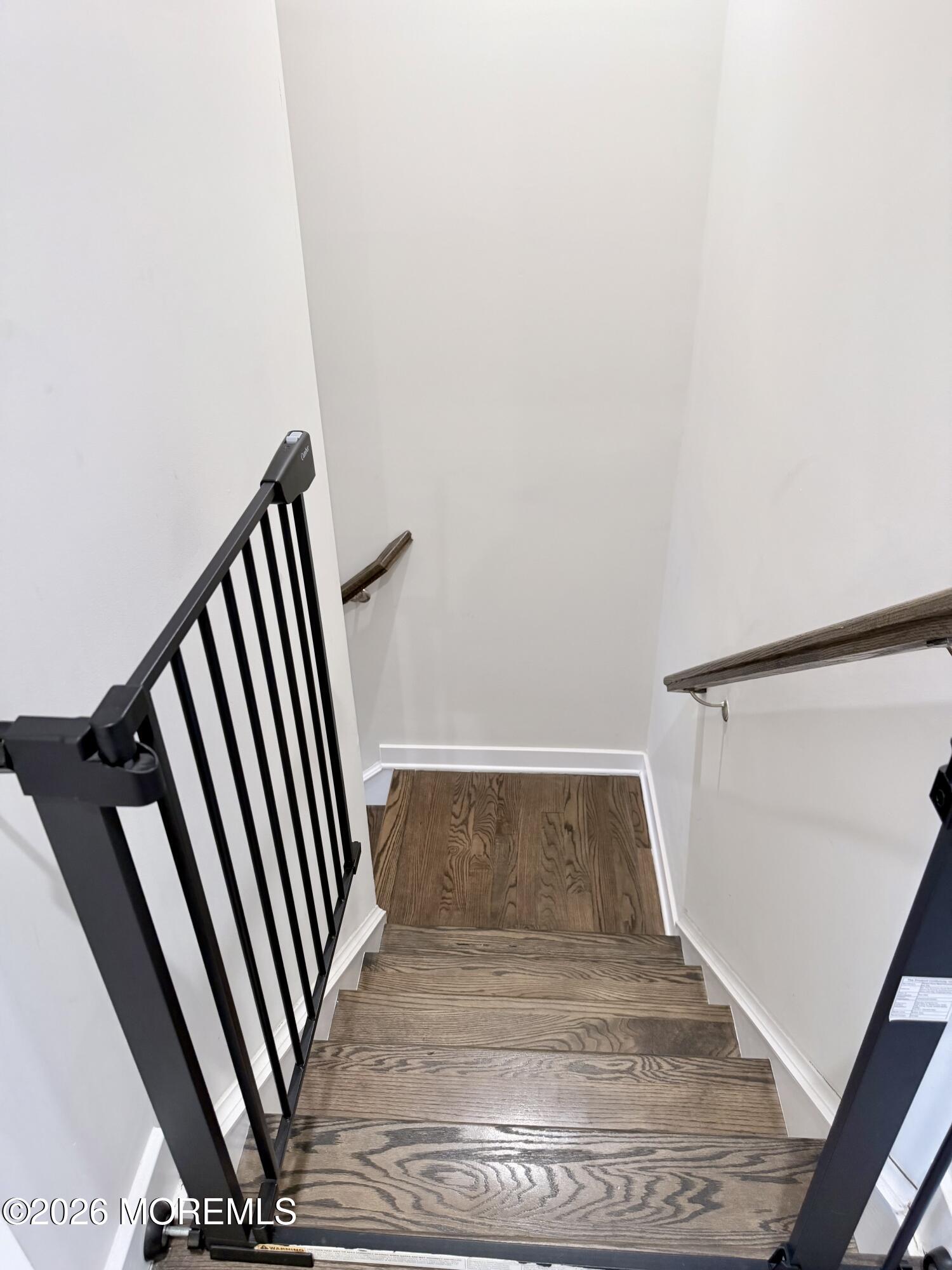 1207 English Lane, Unit 1207 Parlin, NJ 08859 - Photo 23 of 56 a view of staircase with white walls and a window