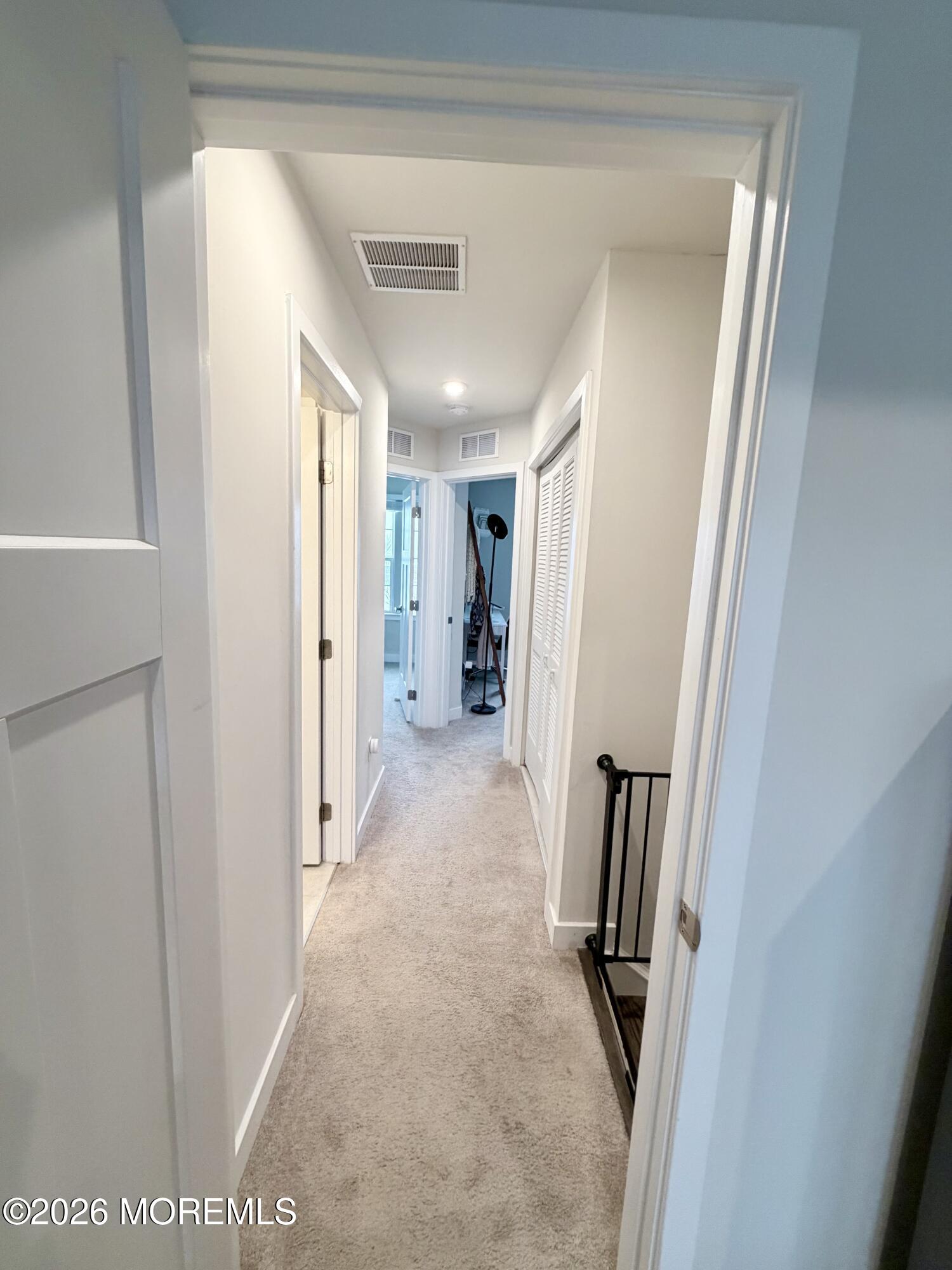 1207 English Lane, Unit 1207 Parlin, NJ 08859 - Photo 24 of 56 a view of hallway with stairs and a closet