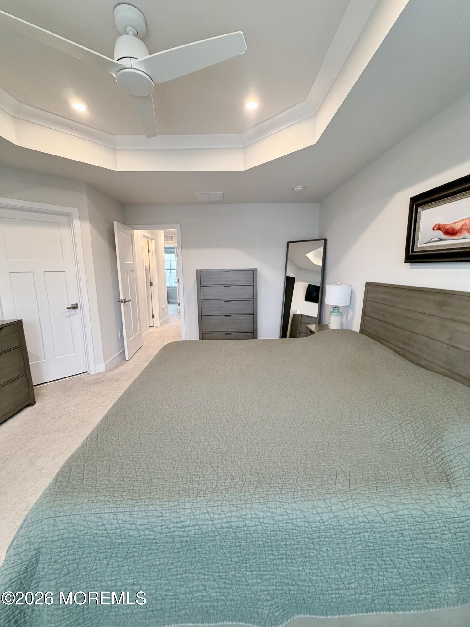 1207 English Lane, Unit 1207 Parlin, NJ 08859 - Photo 35 of 56 a bedroom with furniture and a chandelier