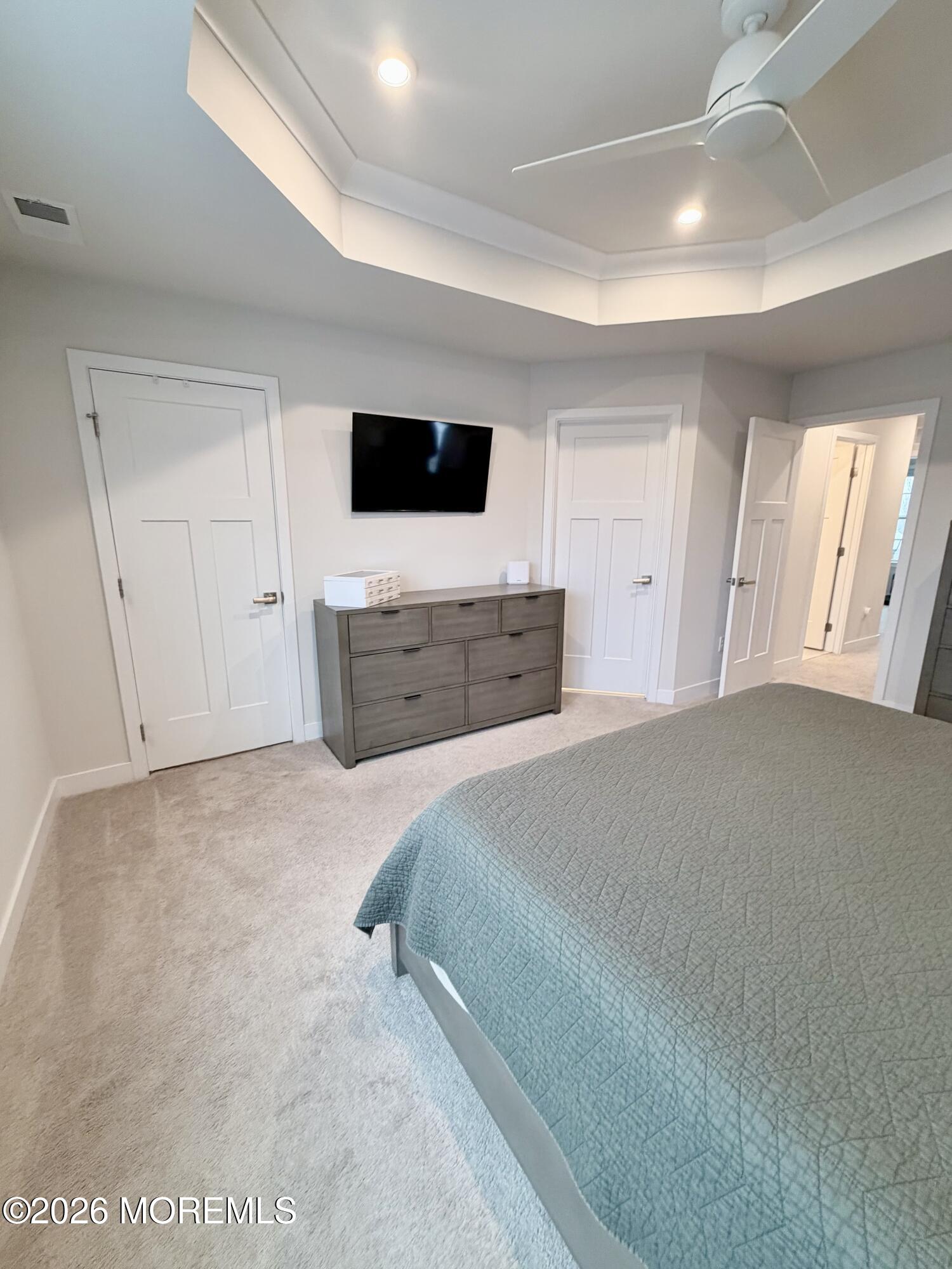 1207 English Lane, Unit 1207 Parlin, NJ 08859 - Photo 38 of 56 a spacious bedroom with a bed and a flat screen tv
