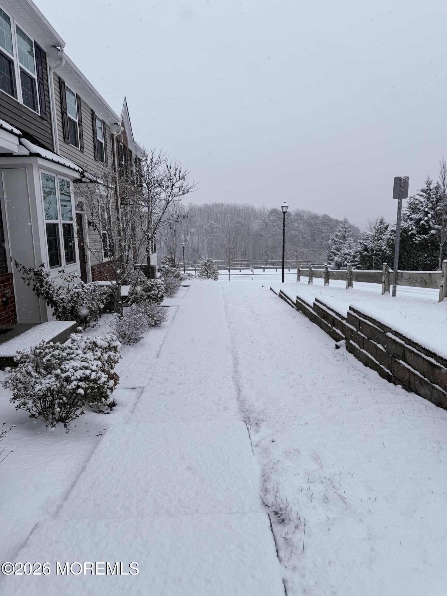 1207 English Lane, Unit 1207 Parlin, NJ 08859 - Photo 4 of 56 a view of a terrace with a bench