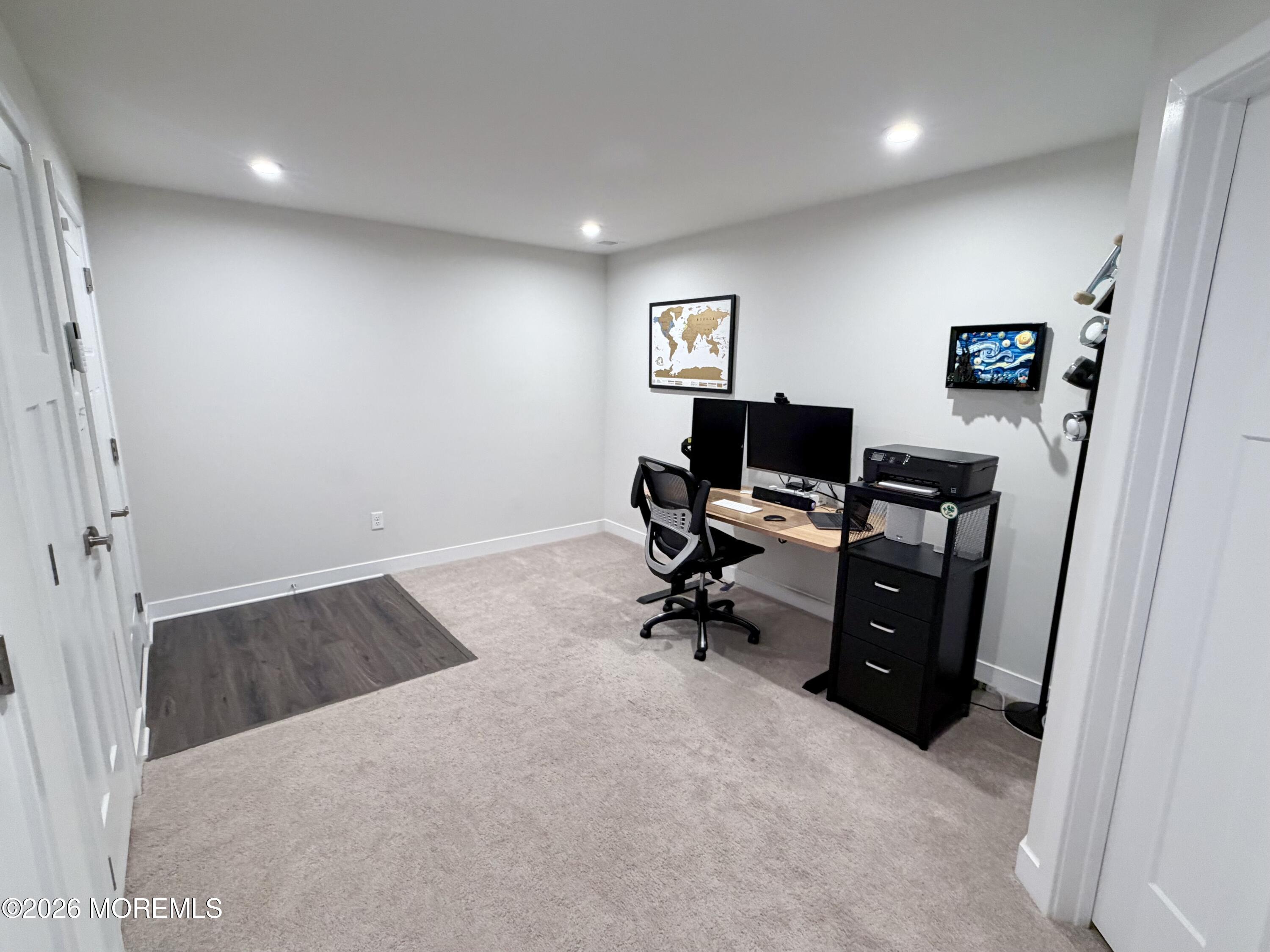 1207 English Lane, Unit 1207 Parlin, NJ 08859 - Photo 44 of 56 wooden floor and chair in a room