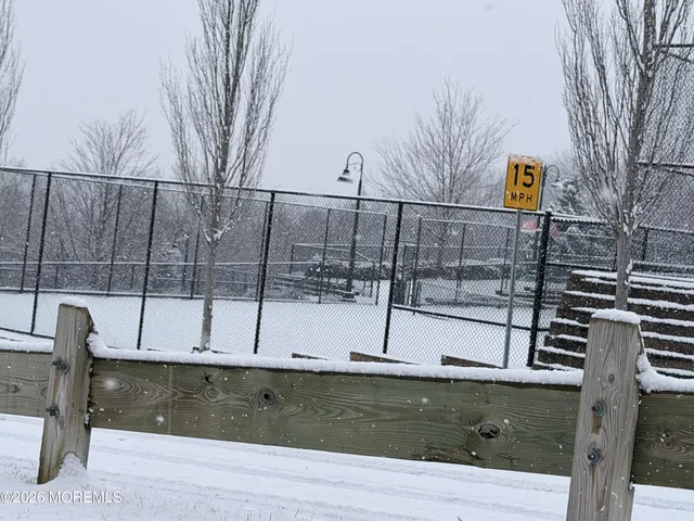 a bathroom with a double vanity sink and mirror