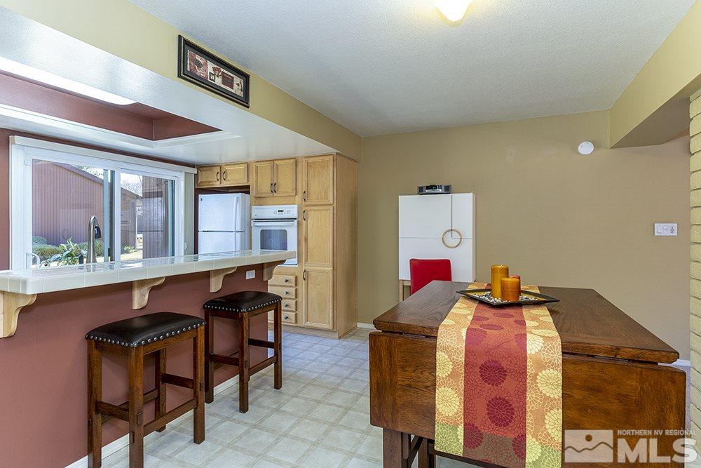 1860 Villa Way Reno, NV 89509 - Photo 7 of 21 a bedroom with a bed and a table in it