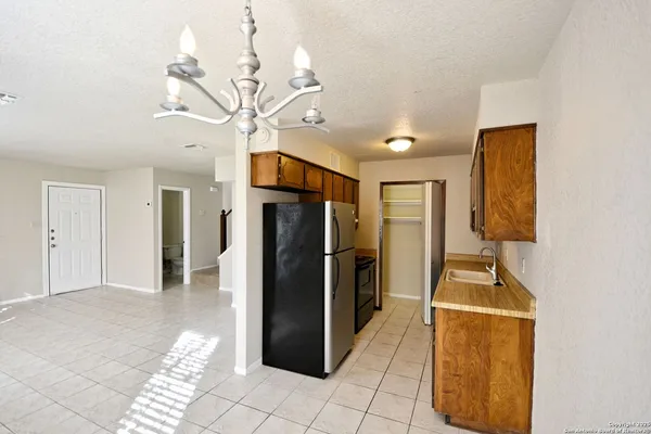a kitchen with a stove and a refrigerator
