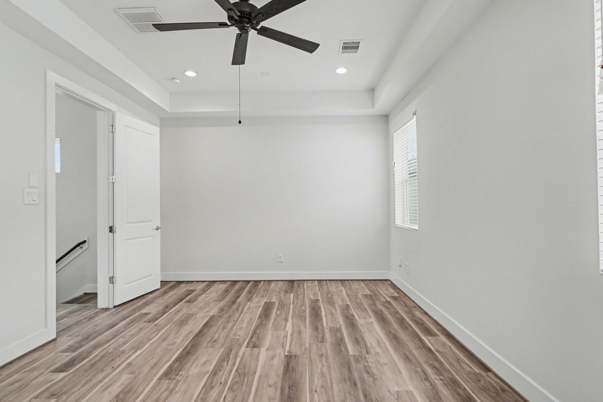 2504 West Tidwell Road, Unit B Houston, TX 77091 - Photo 17 of 24 Tucked away on the second floor,
this room has tray ceilings, and a
private ensuite bathroom.
