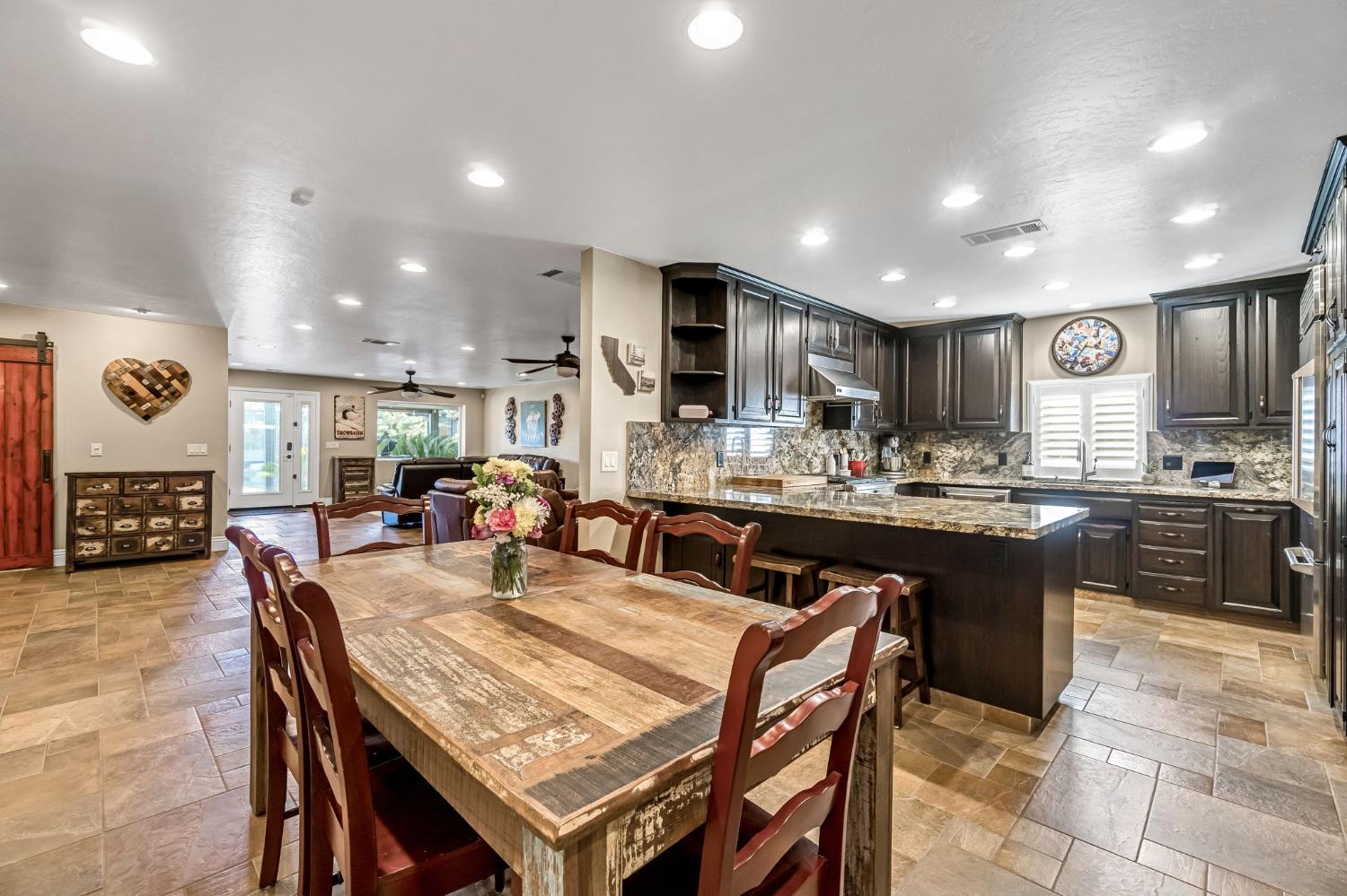 505 Ash Street Lemoore, CA 93245 - Photo 20 of 66 a kitchen with a table and chairs in it