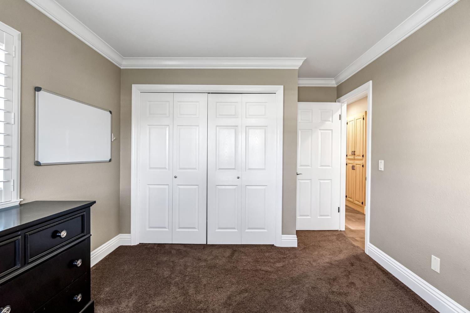 505 Ash Street Lemoore, CA 93245 - Photo 24 of 66 a view of an empty room with cabinet and a window
