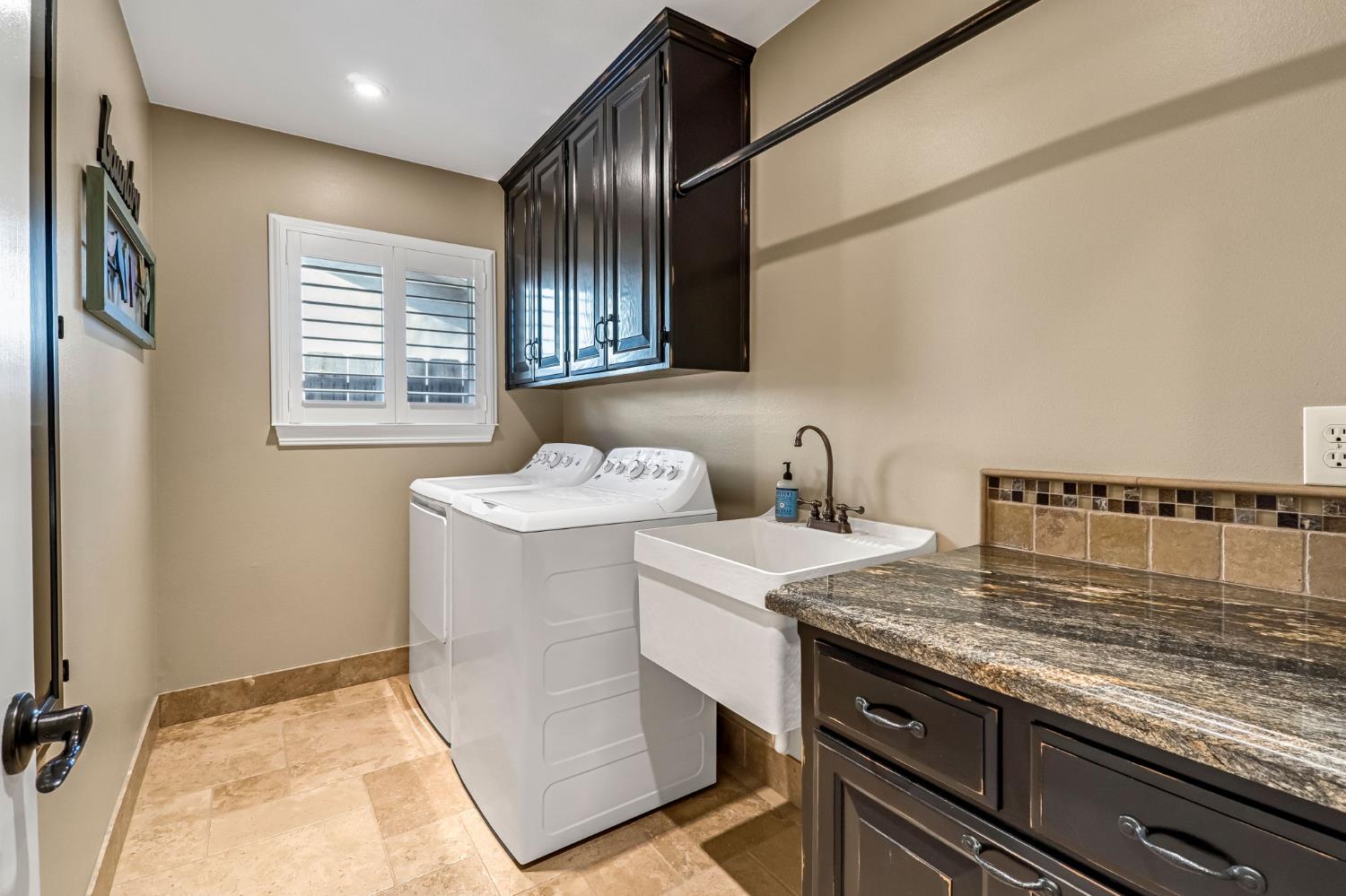 505 Ash Street Lemoore, CA 93245 - Photo 27 of 66 a room with storage and utility