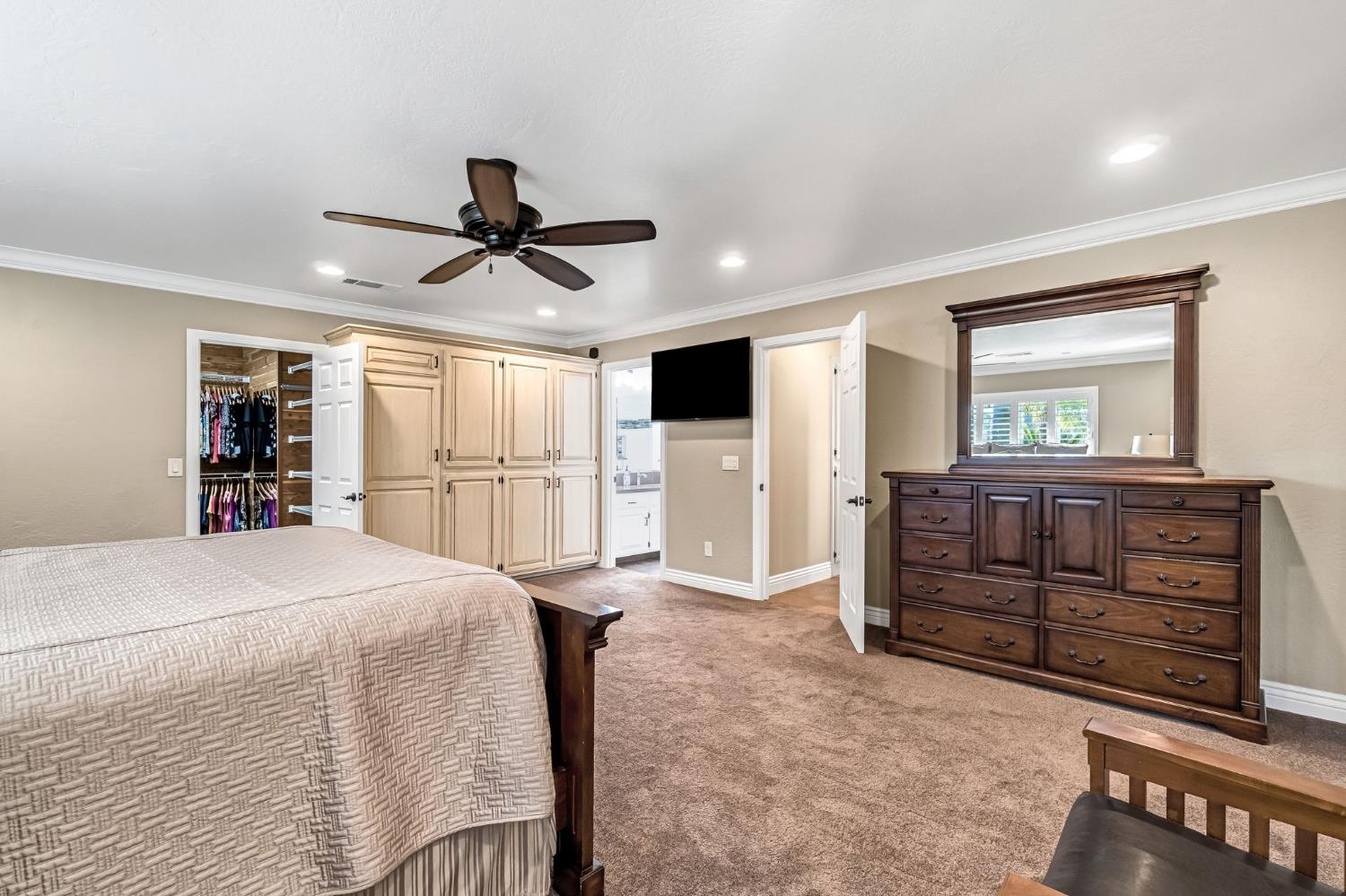 505 Ash Street Lemoore, CA 93245 - Photo 29 of 66 a bedroom with a bed and a flat screen tv