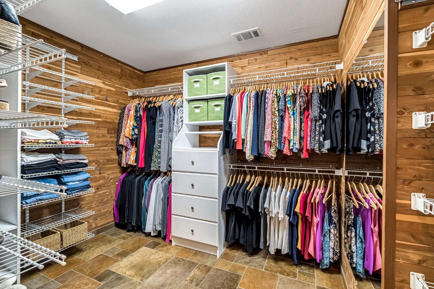 505 Ash Street Lemoore, CA 93245 - Photo 30 of 66 a view of walk in closet with clothes and shoes