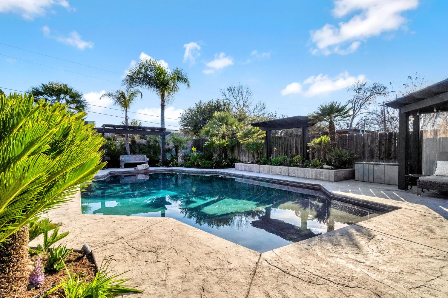 505 Ash Street Lemoore, CA 93245 - Photo 33 of 66 a view of a swimming pool with a patio