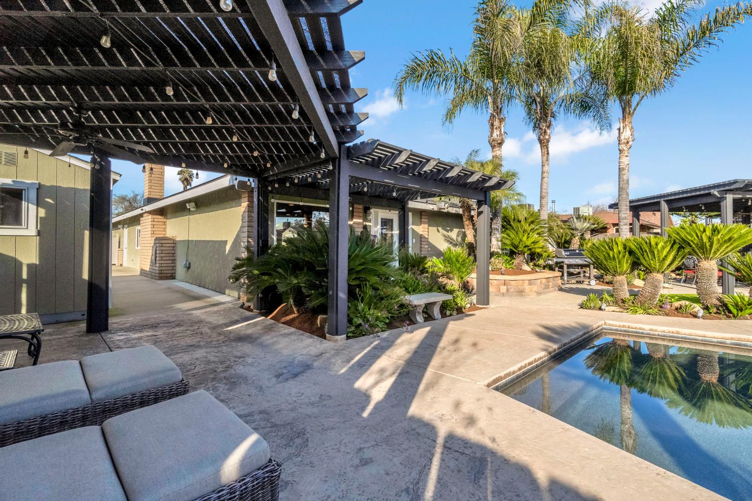 505 Ash Street Lemoore, CA 93245 - Photo 35 of 66 a view of swimming pool with outdoor seating and a patio