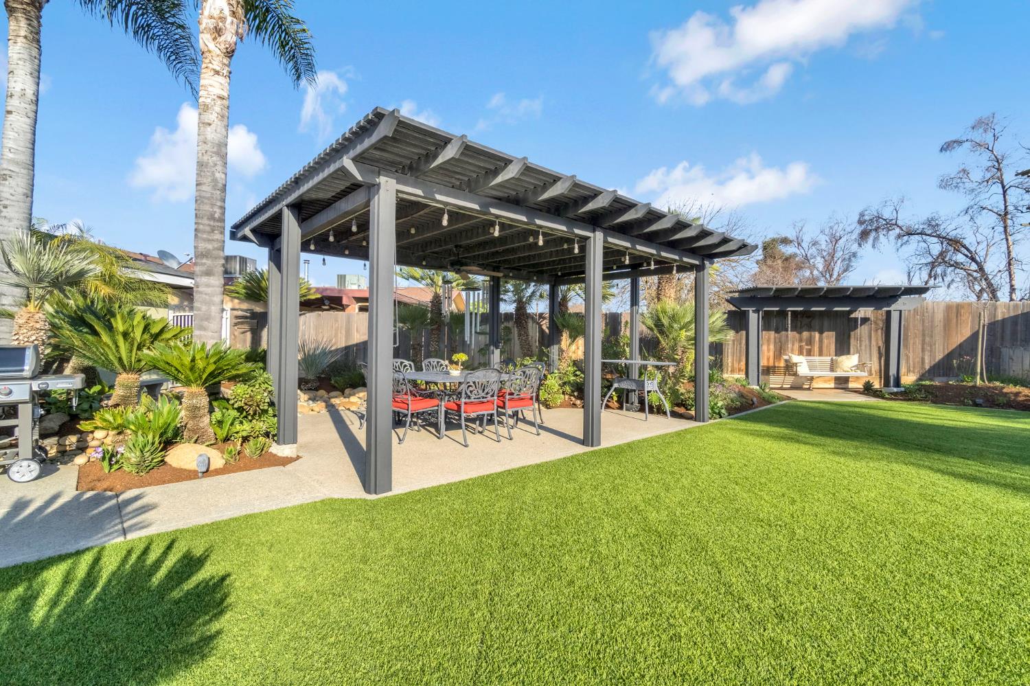 505 Ash Street Lemoore, CA 93245 - Photo 41 of 66 a view of a house with sitting area and garden