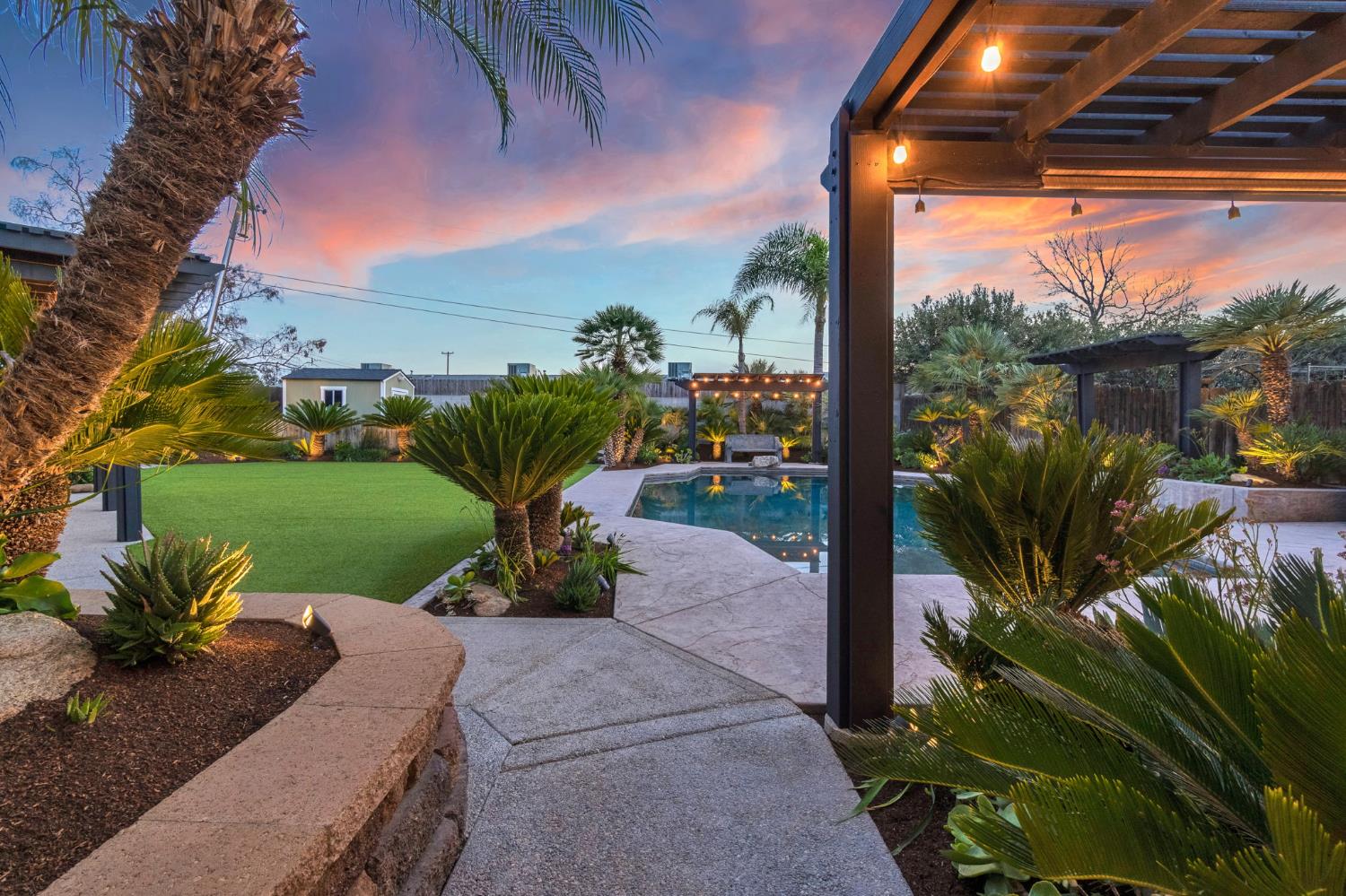 505 Ash Street Lemoore, CA 93245 - Photo 44 of 66 a view of a garden with potted plants