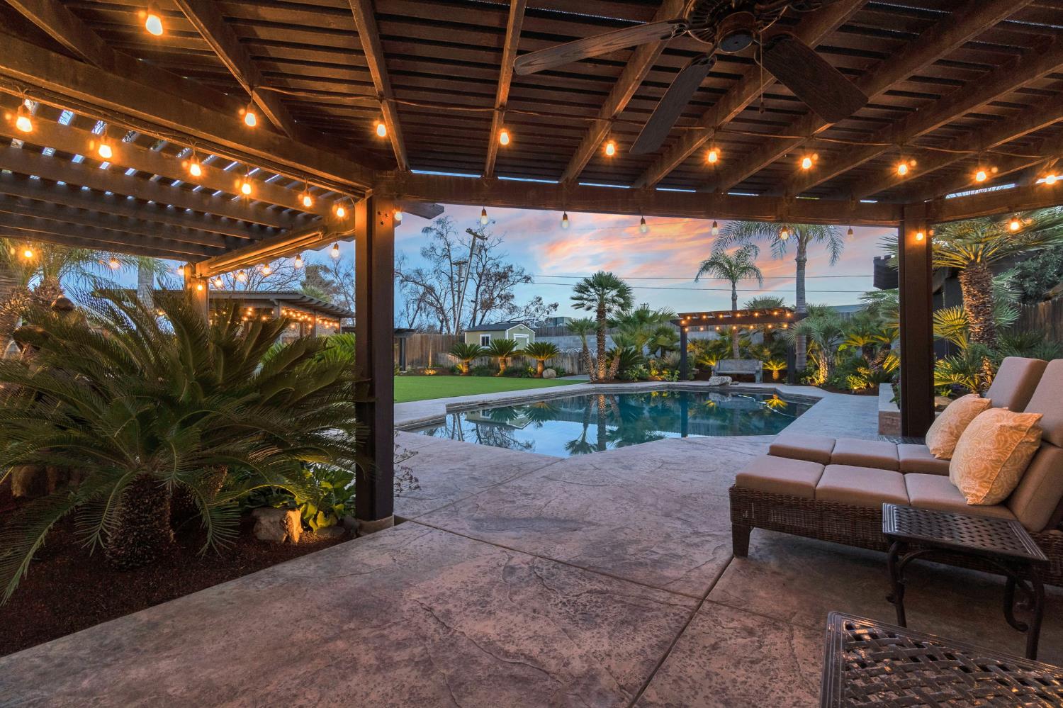 505 Ash Street Lemoore, CA 93245 - Photo 45 of 66 a view of a porch with furniture and a yard