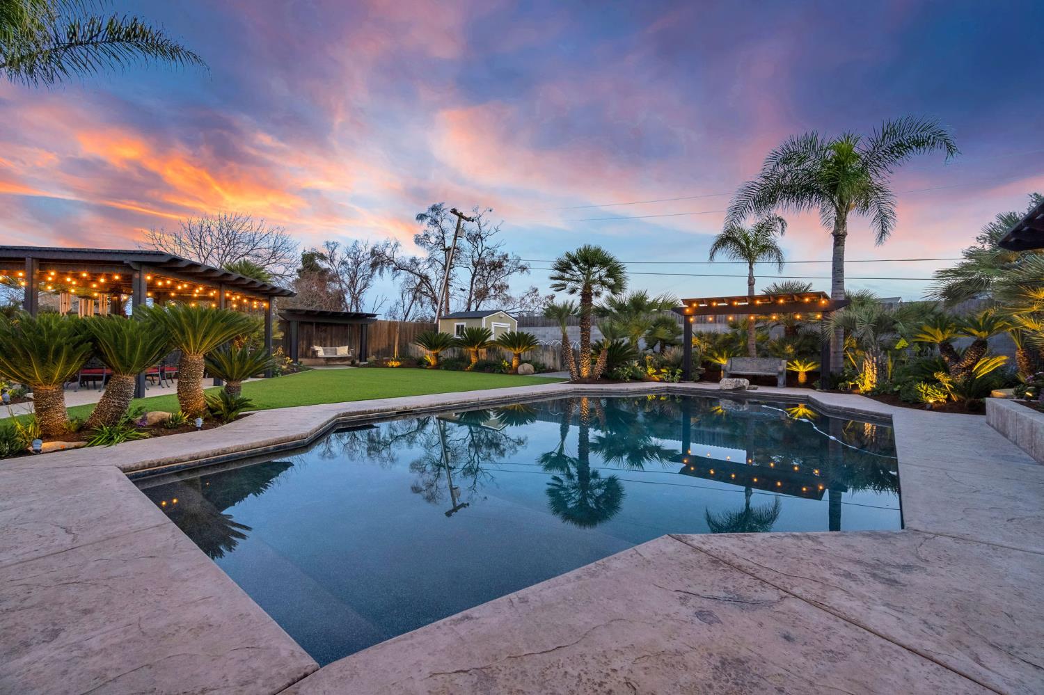 505 Ash Street Lemoore, CA 93245 - Photo 46 of 66 a view of swimming pool with outdoor seating and plants