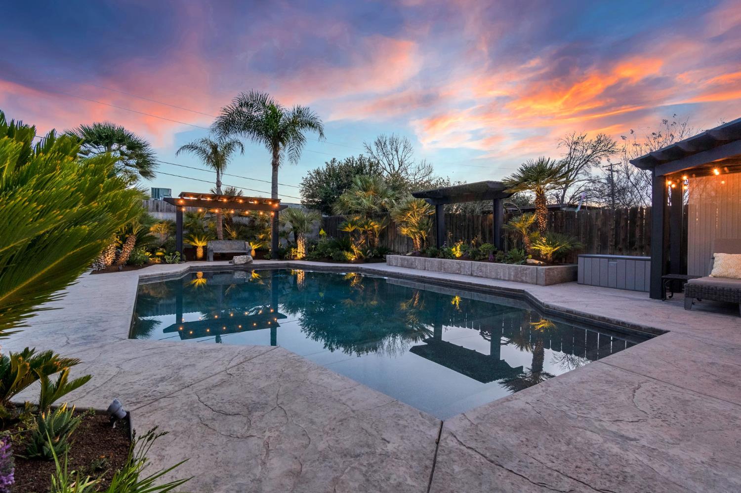 505 Ash Street Lemoore, CA 93245 - Photo 47 of 66 a view of a swimming pool with a patio