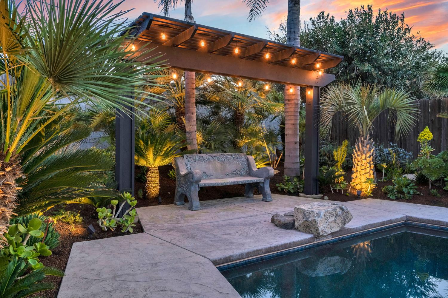 505 Ash Street Lemoore, CA 93245 - Photo 48 of 66 a backyard of a house with barbeque oven table and chairs