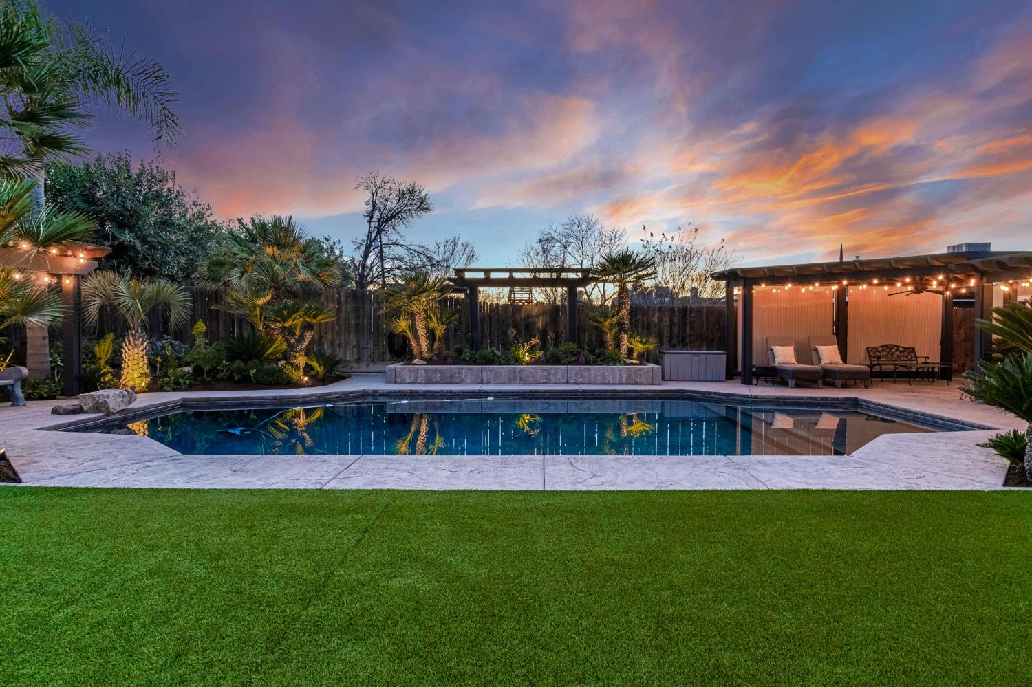 505 Ash Street Lemoore, CA 93245 - Photo 55 of 66 a view of a swimming pool with a yard