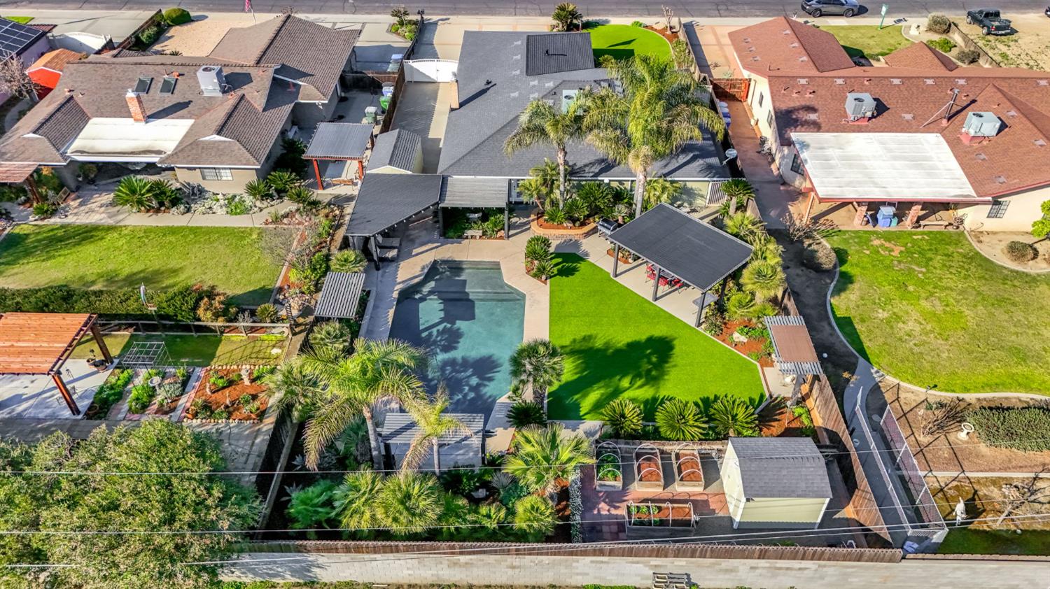 505 Ash Street Lemoore, CA 93245 - Photo 65 of 66 an aerial view of residential houses with outdoor space and trees