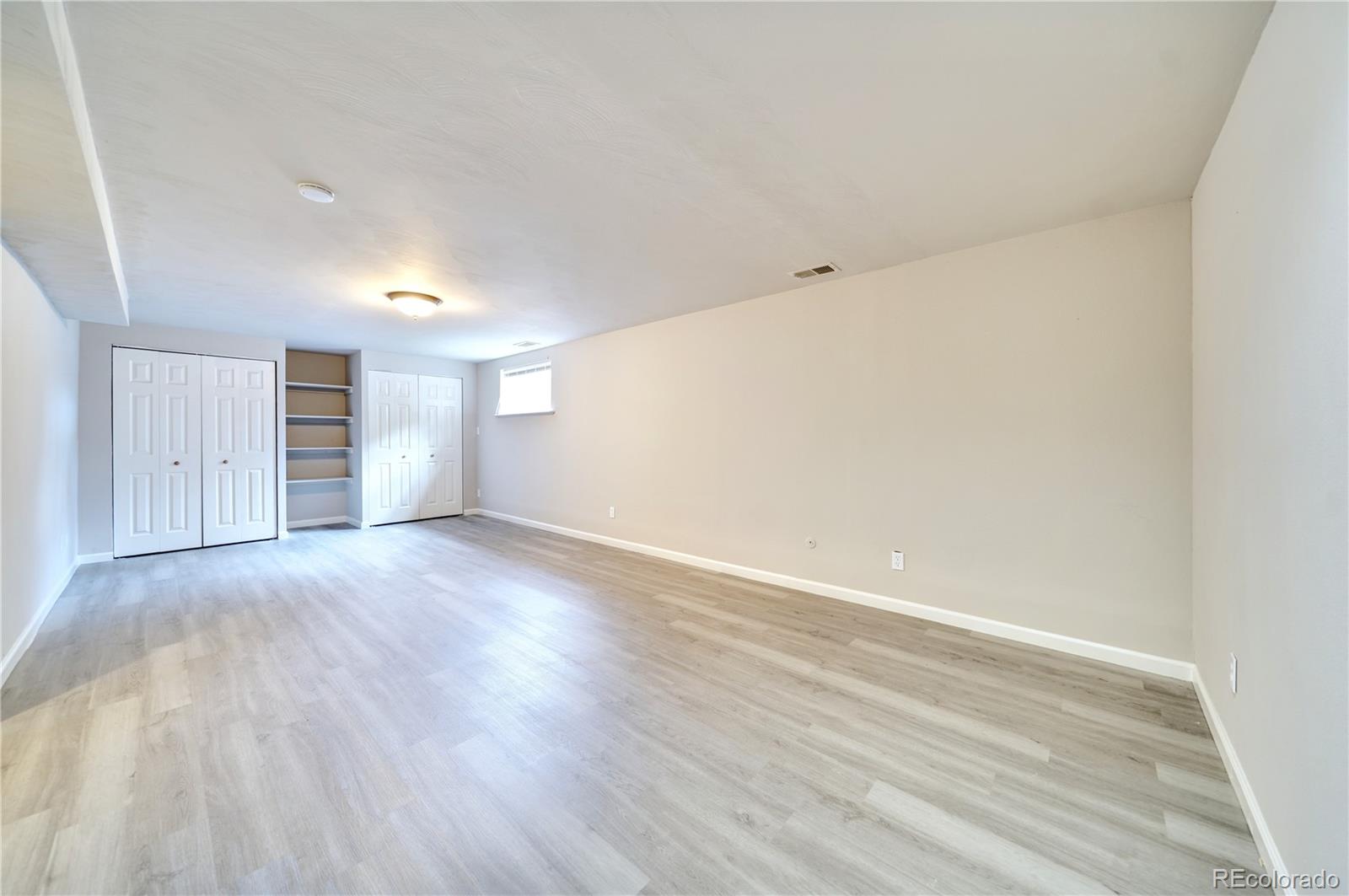 1206 Westmoreland Road Colorado Springs, CO 80907 - Photo 19 of 33 a view of empty room with wooden floor