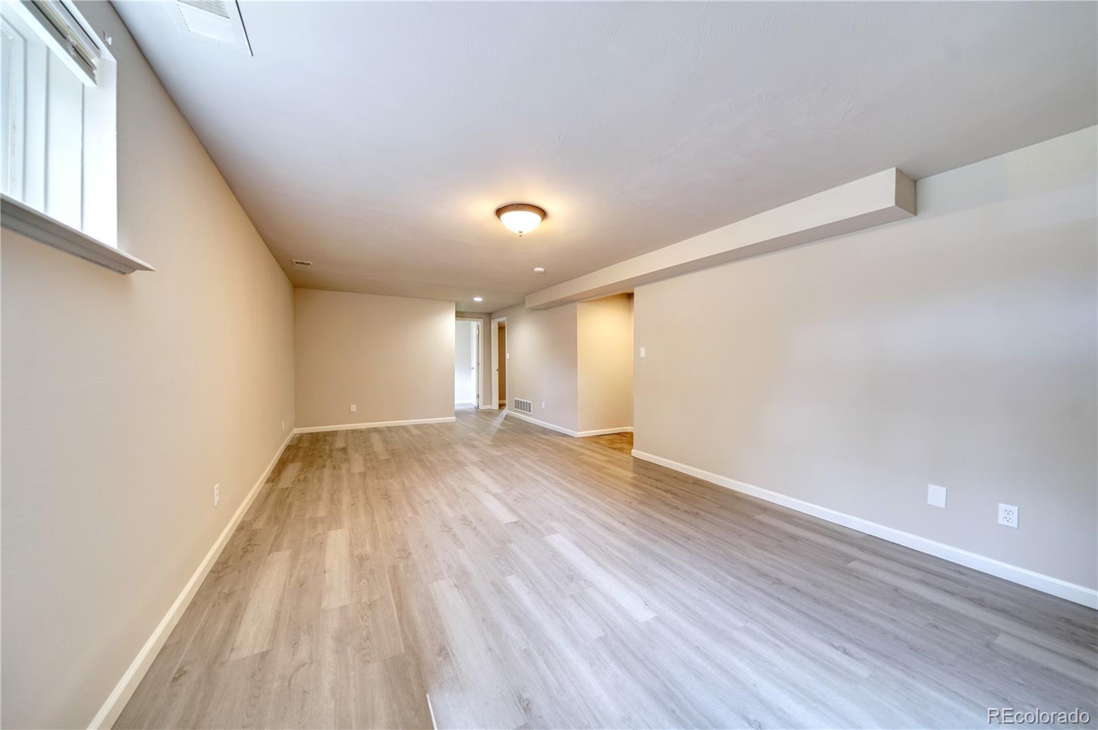 1206 Westmoreland Road Colorado Springs, CO 80907 - Photo 20 of 33 a view of empty room with wooden floor