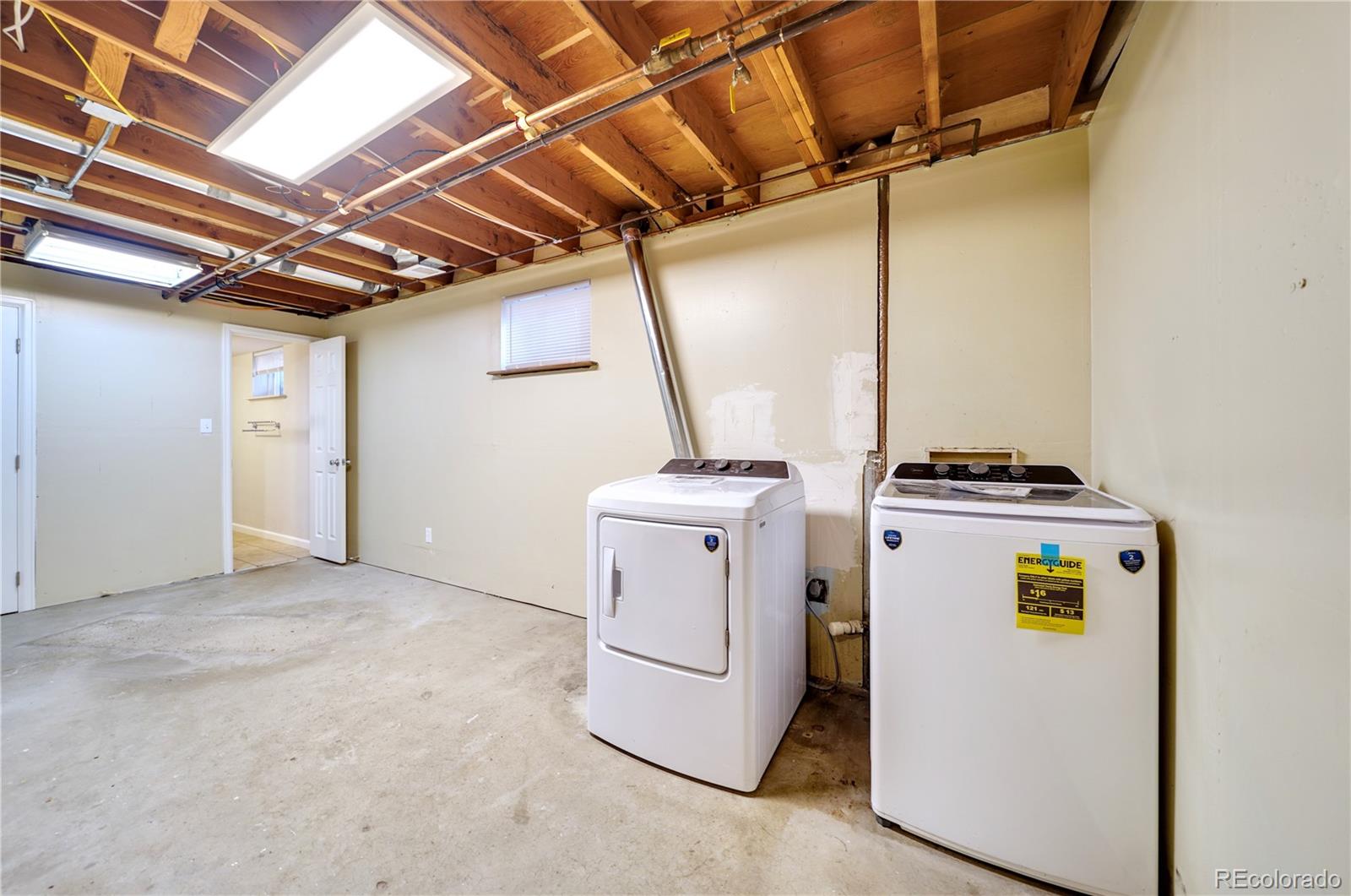 1206 Westmoreland Road Colorado Springs, CO 80907 - Photo 27 of 33 a utility room with dryer and washer